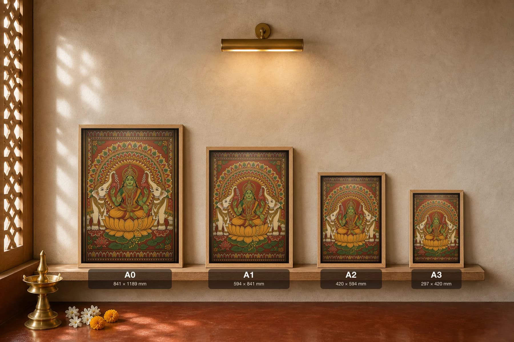 Gajalakshmi Kerala Mural Art Print — Lakshmi on the lotus with anointing elephants, flat panchavarna bhitti-chitra style, collector edition of 500 — print size guide showing the artwork at A0, A1, A2 and A3 in natural-oak frames at true relative scale