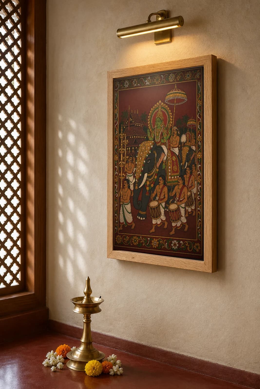 Utsavam Temple Festival Night Kerala Mural Art Print — a deity carried on a caparisoned elephant by lamplight with drummers in panchavarna bhitti-chitra style · collector edition A2 — the framed print shown at a three-quarter angle on a styled gallery wall in a natural-oak frame