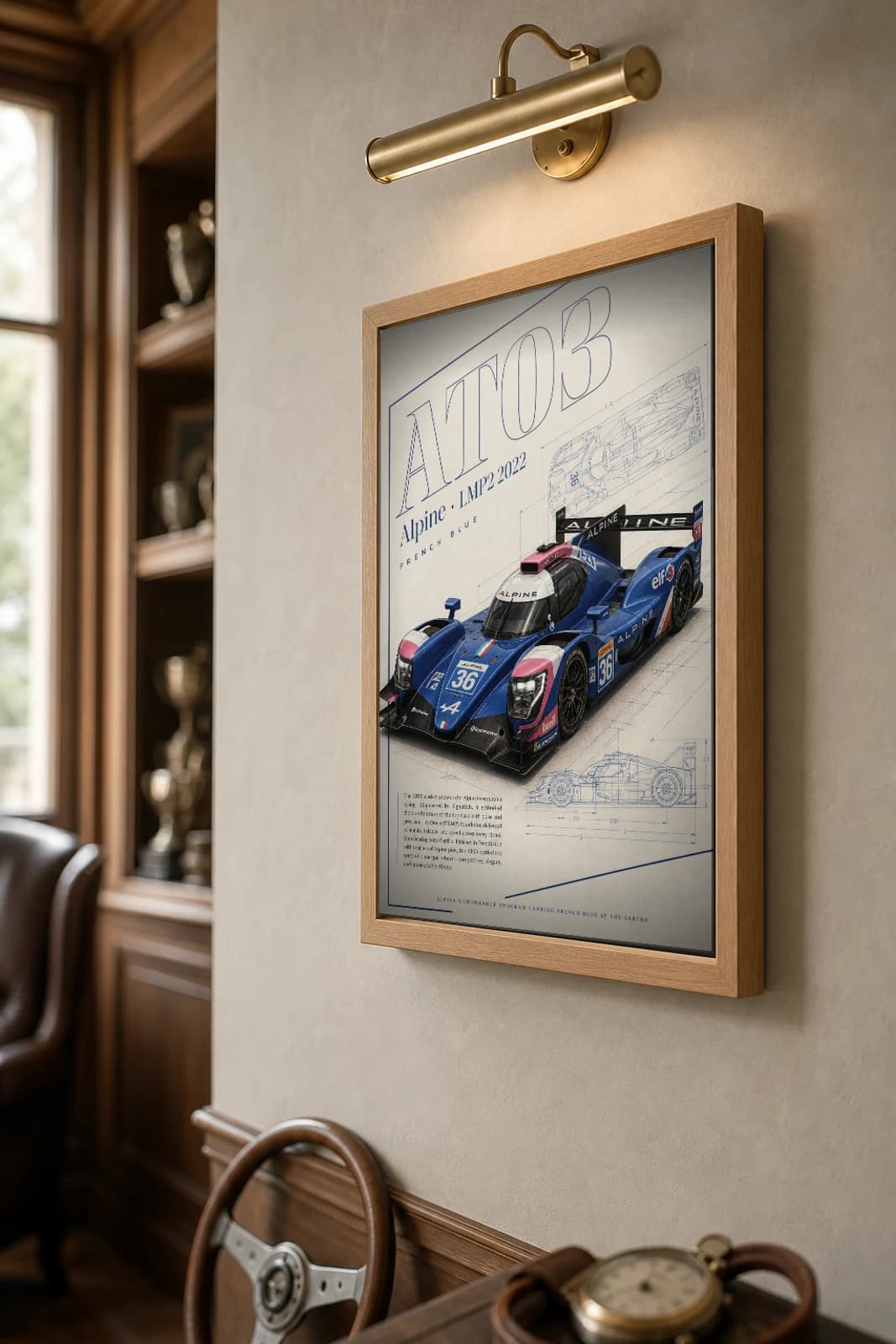 Alpine AT03 LMP2 Poster — 2022 24 Hours of Le Mans Endurance Racing Wall Art · framed A2 — the framed print shown at a three-quarter angle on a styled gallery wall in a natural-oak frame