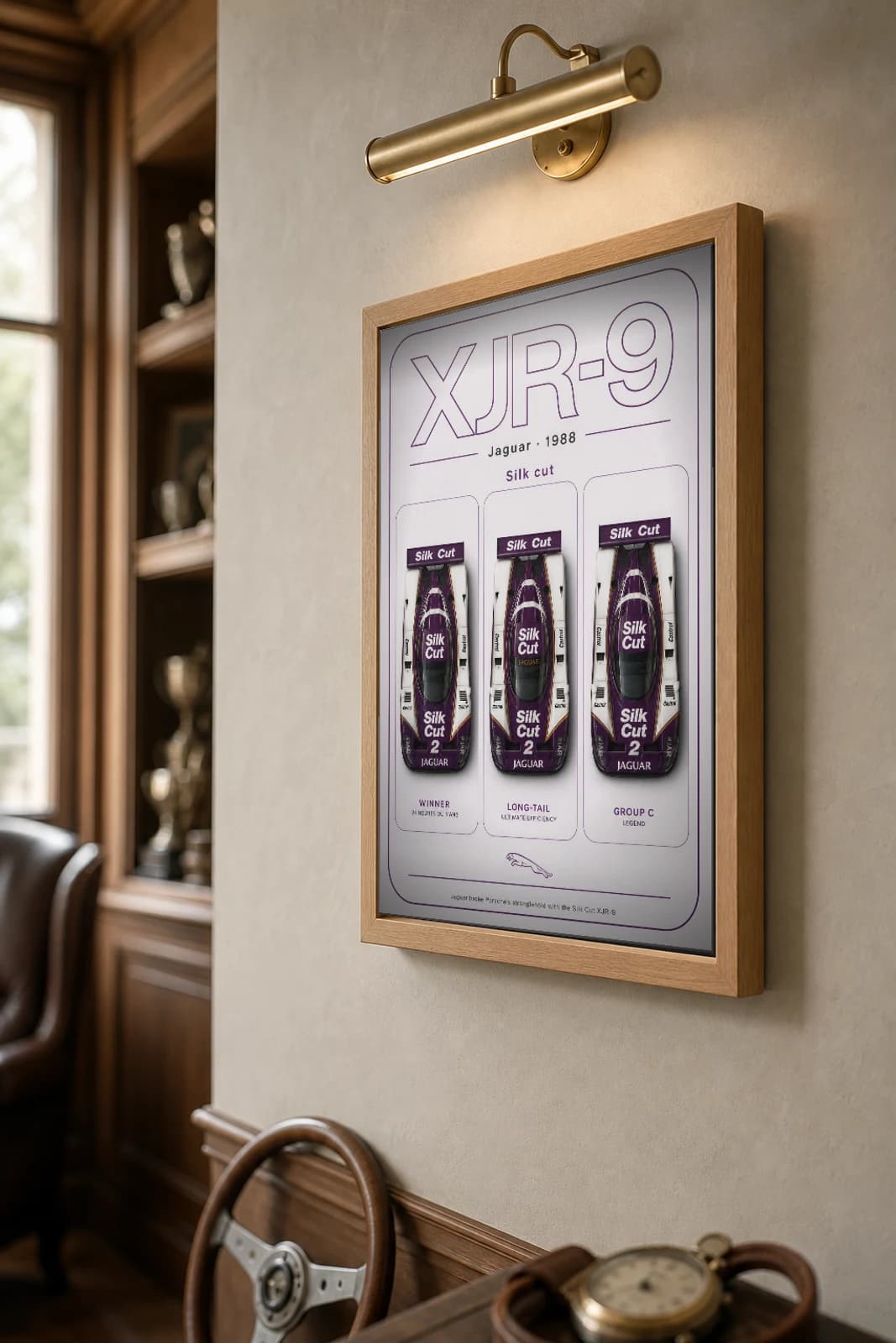 Jaguar XJR-9 Poster — 1988 24 Hours of Le Mans Endurance Racing Wall Art · framed A2 — the framed print shown at a three-quarter angle on a styled gallery wall in a natural-oak frame