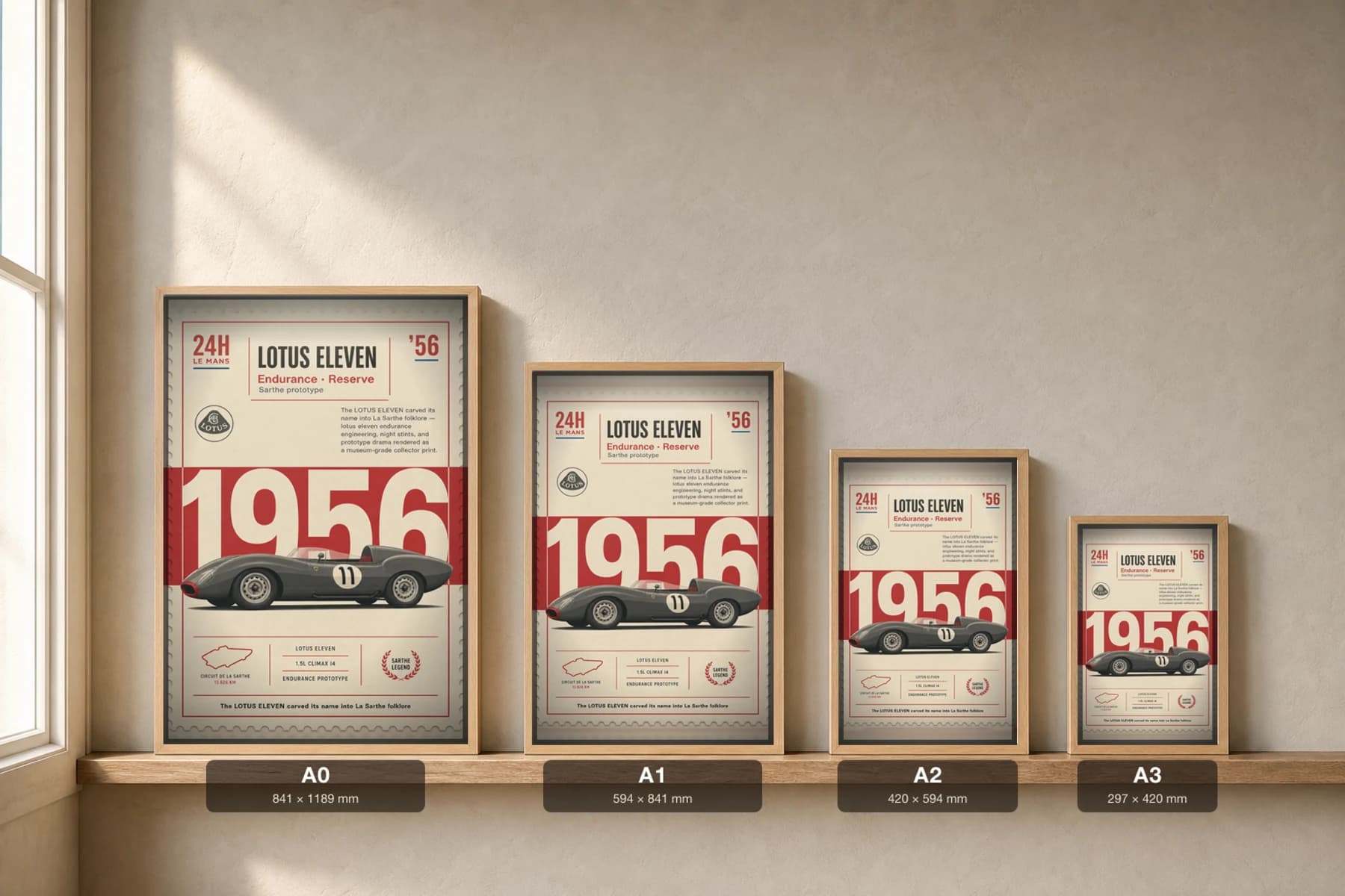 Lotus Eleven Poster — 1956 24 Hours of Le Mans Endurance Racing Wall Art · framed A2 — print size guide showing the artwork at A0, A1, A2 and A3 in natural-oak frames at true relative scale