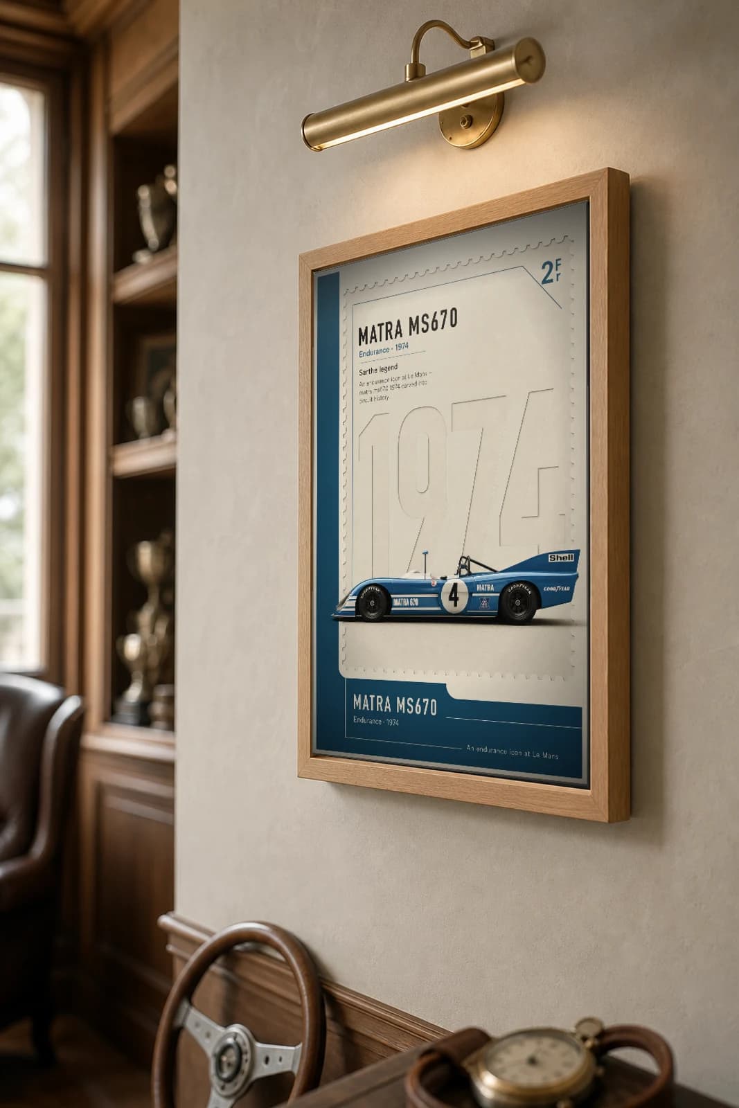 Matra MS670 Poster — 1974 24 Hours of Le Mans Endurance Racing Wall Art · framed A2 — the framed print shown at a three-quarter angle on a styled gallery wall in a natural-oak frame