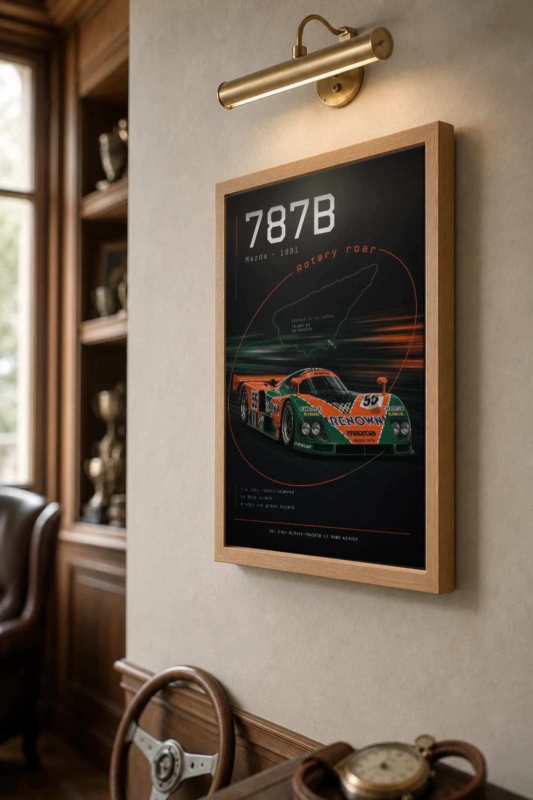 Mazda 787B Poster — 1991 24 Hours of Le Mans Endurance Racing Wall Art · framed A2 — the framed print shown at a three-quarter angle on a styled gallery wall in a natural-oak frame