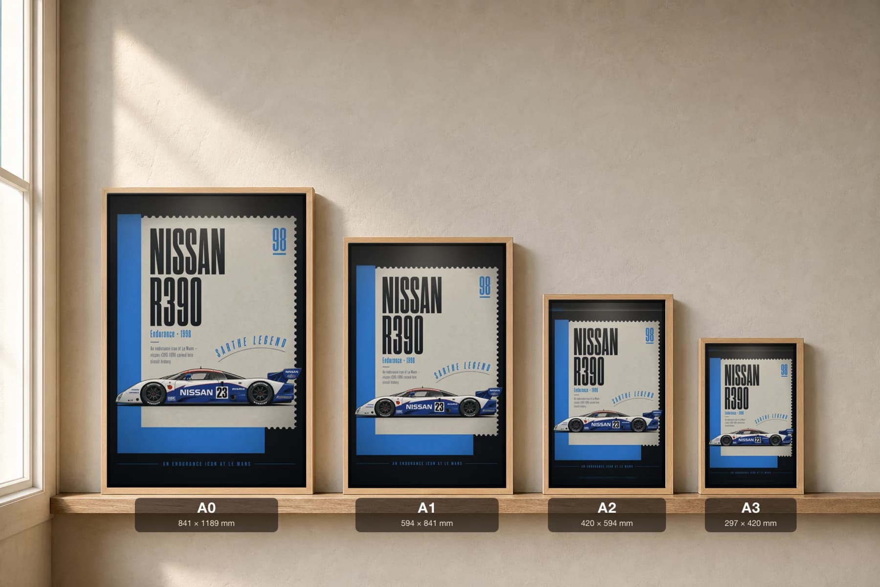Nissan R390 GT1 Poster — 1998 24 Hours of Le Mans Endurance Racing Wall Art · framed A2 — print size guide showing the artwork at A0, A1, A2 and A3 in natural-oak frames at true relative scale