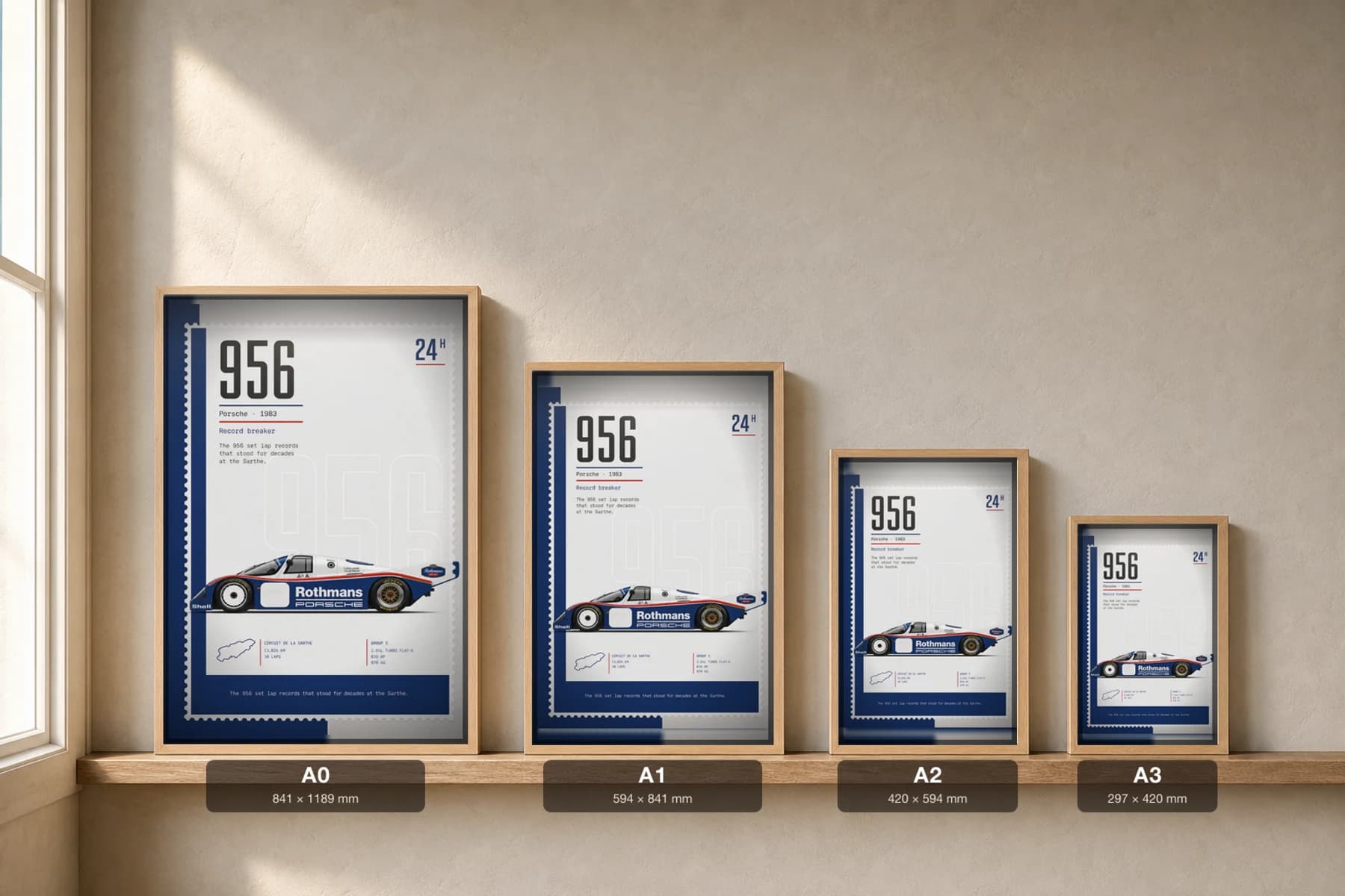 Porsche 956 Poster — 1983 24 Hours of Le Mans Endurance Racing Wall Art · framed A2 — print size guide showing the artwork at A0, A1, A2 and A3 in natural-oak frames at true relative scale