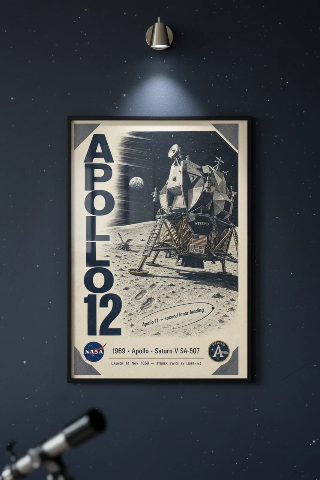 Apollo 12 poster in black A2 frame on deep-navy-star-field deep space navy wall — NASA Heritage collector study mockup