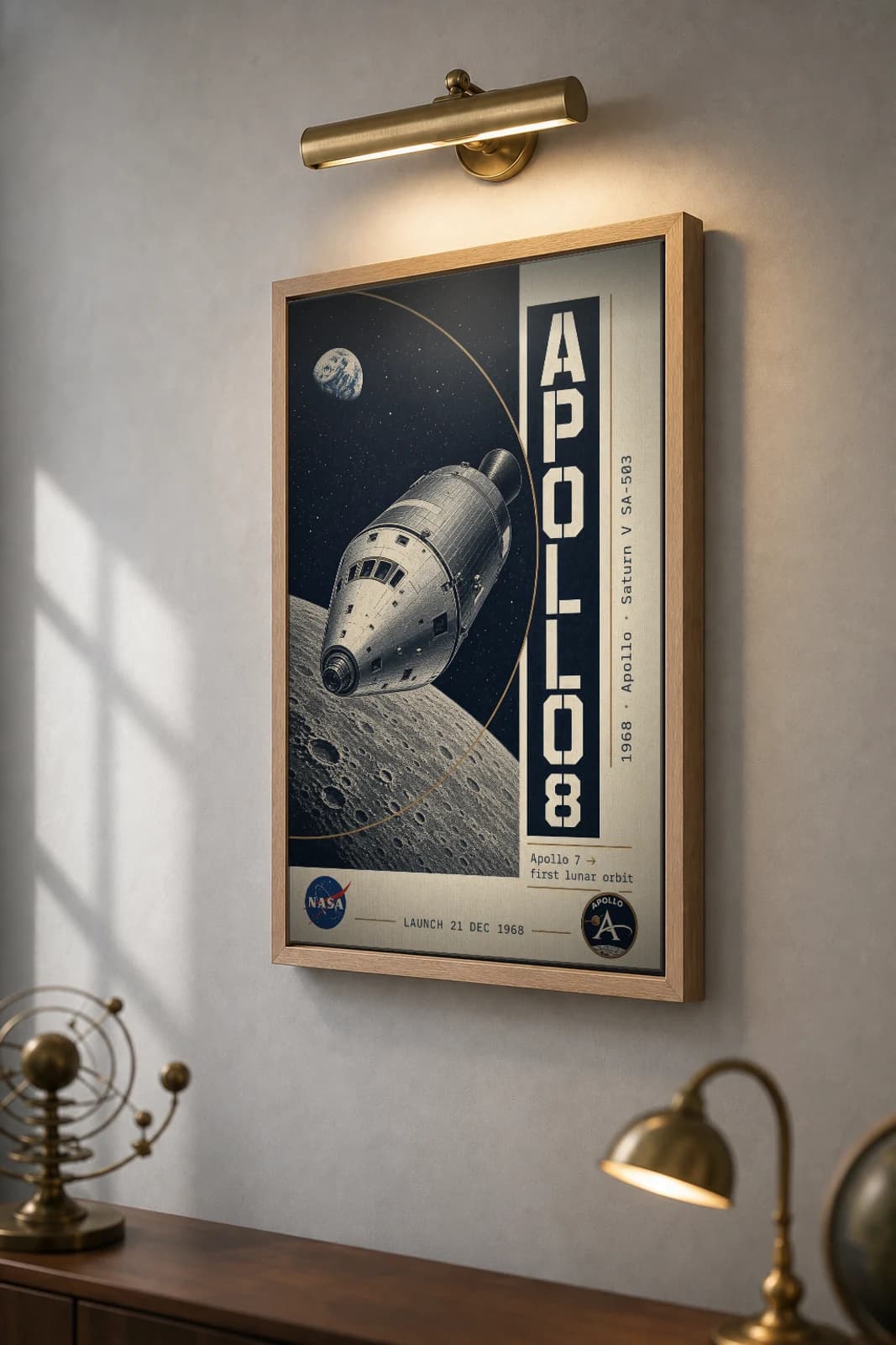 Apollo 8 Poster — 1968 Saturn V SA-503 NASA Heritage Collector Print — the framed print shown at a three-quarter angle on a styled gallery wall in a natural-oak frame