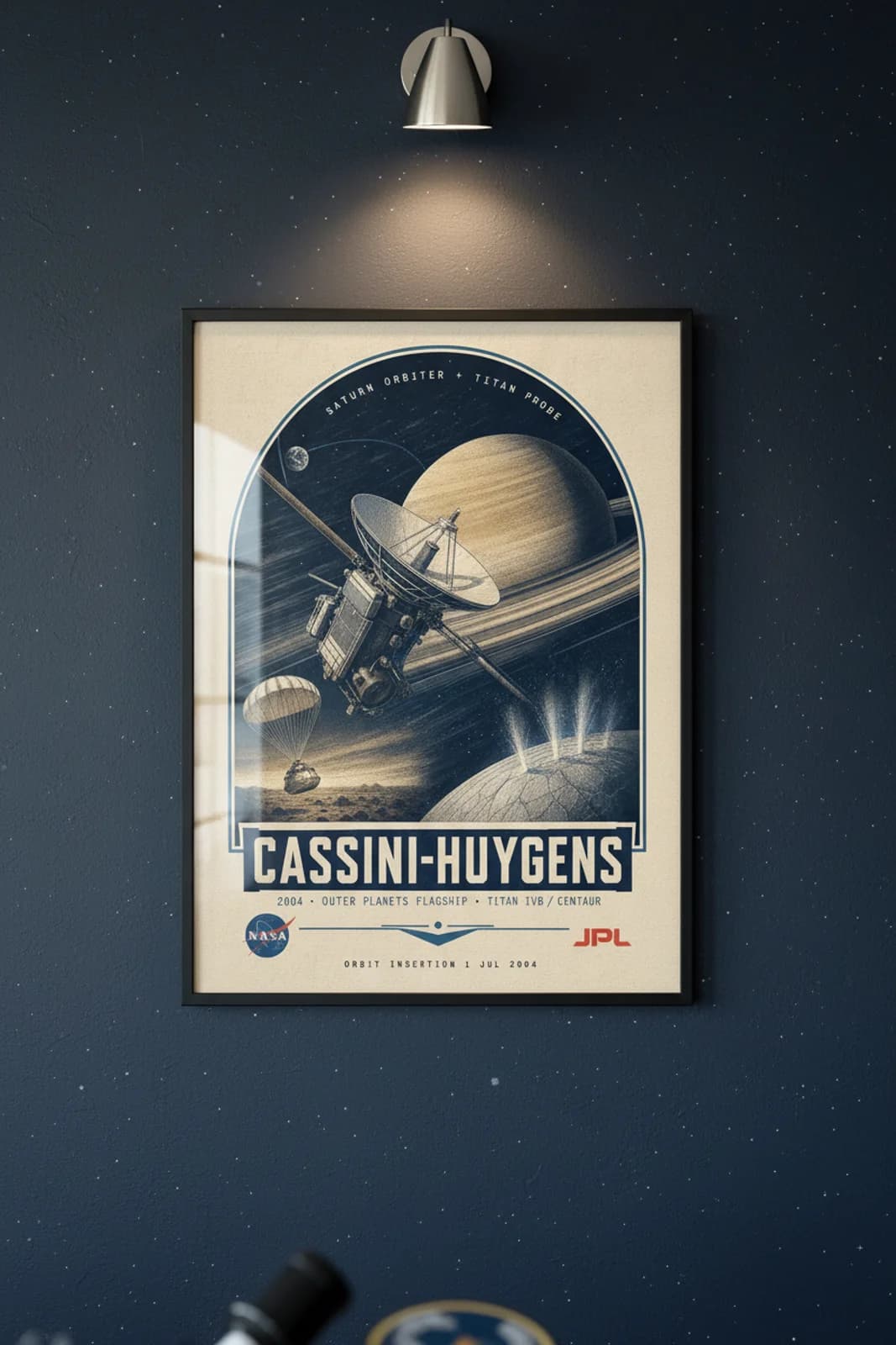 Cassini-Huygens poster in black A2 frame on saturn-gold-bands deep space navy wall — NASA Heritage collector study mockup