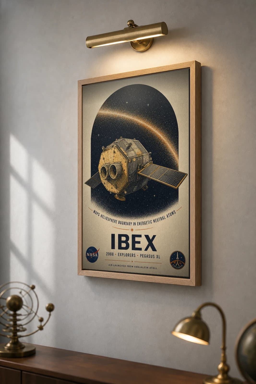 IBEX Poster — 2008 Pegasus XL NASA Heritage Collector Print — the framed print shown at a three-quarter angle on a styled gallery wall in a natural-oak frame