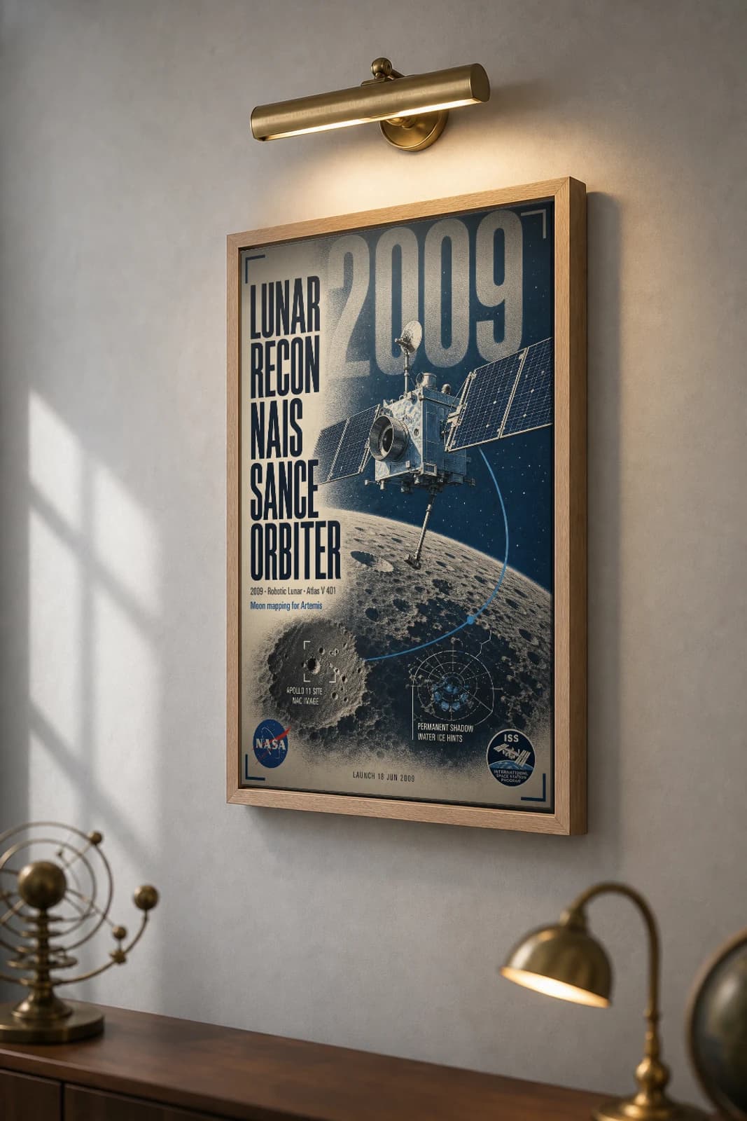 Lunar Reconnaissance Orbiter Poster — 2009 Atlas V 401 NASA Heritage Collector Print — the framed print shown at a three-quarter angle on a styled gallery wall in a natural-oak frame