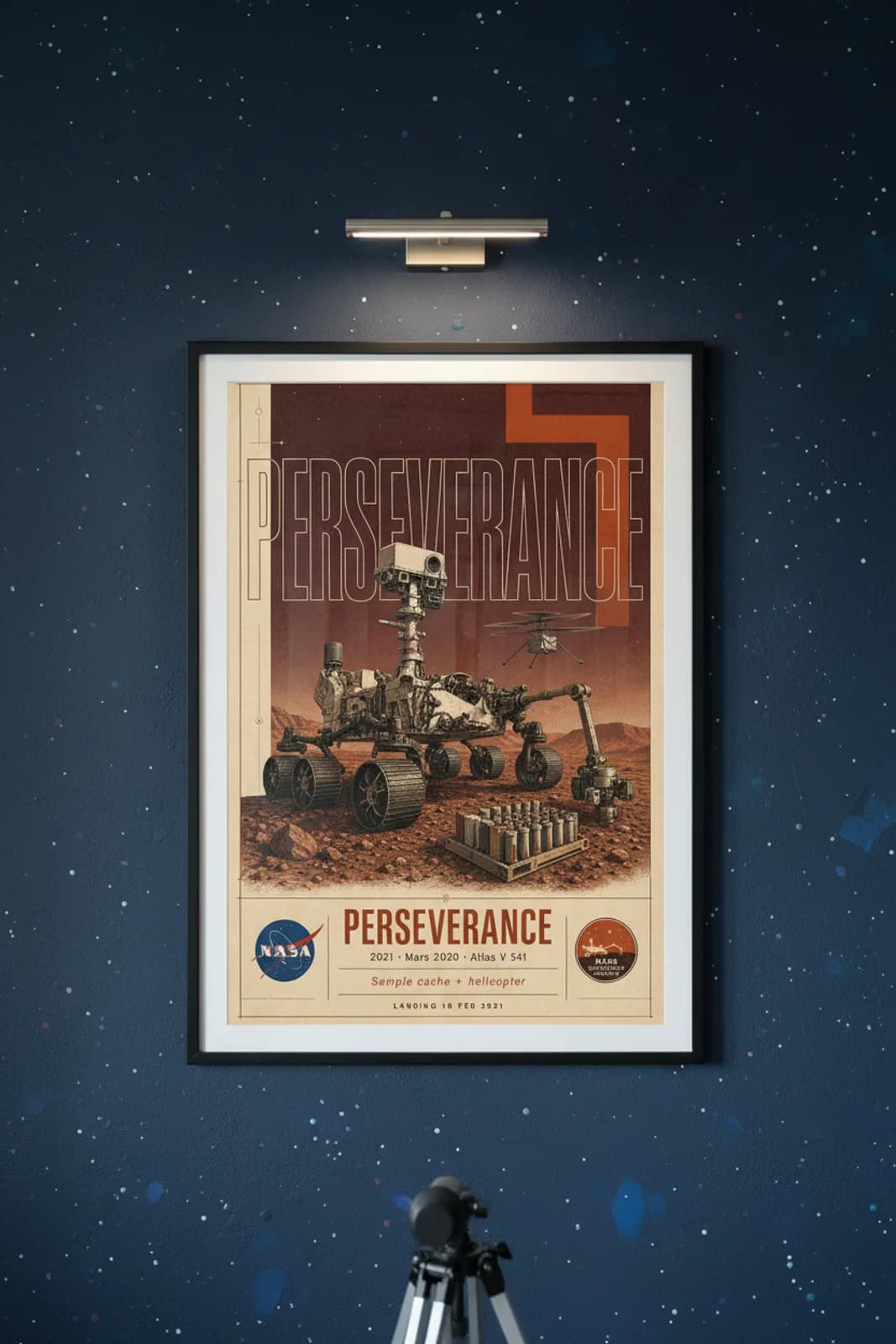 Perseverance poster in black A2 frame on sample-tube-silver deep space navy wall — NASA Heritage collector study mockup