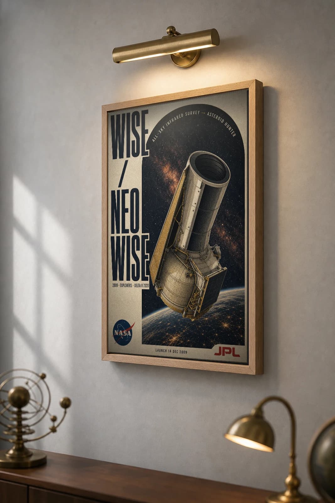WISE / NEOWISE Poster — 2009 Delta II 7320 NASA Heritage Collector Print — the framed print shown at a three-quarter angle on a styled gallery wall in a natural-oak frame