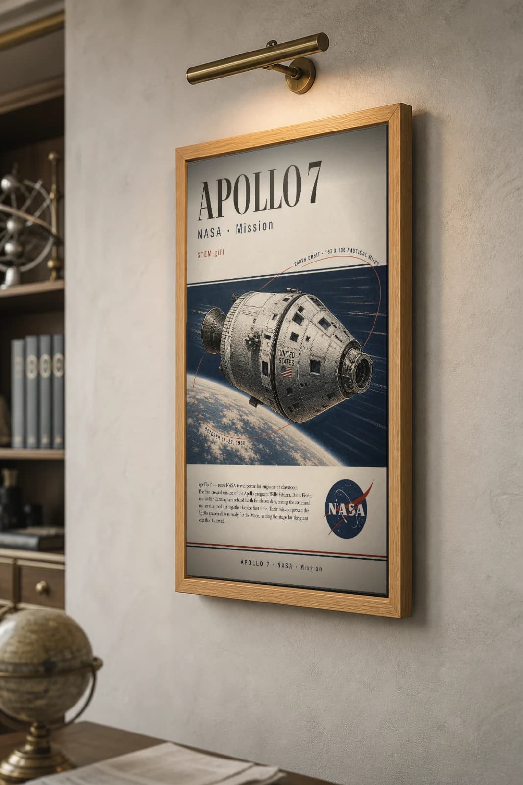 APOLLO 7 Poster — 1968 Saturn IB AS-205 NASA Missions Commemorative Sheet — the framed print shown at a three-quarter angle on a styled gallery wall in a natural-oak frame