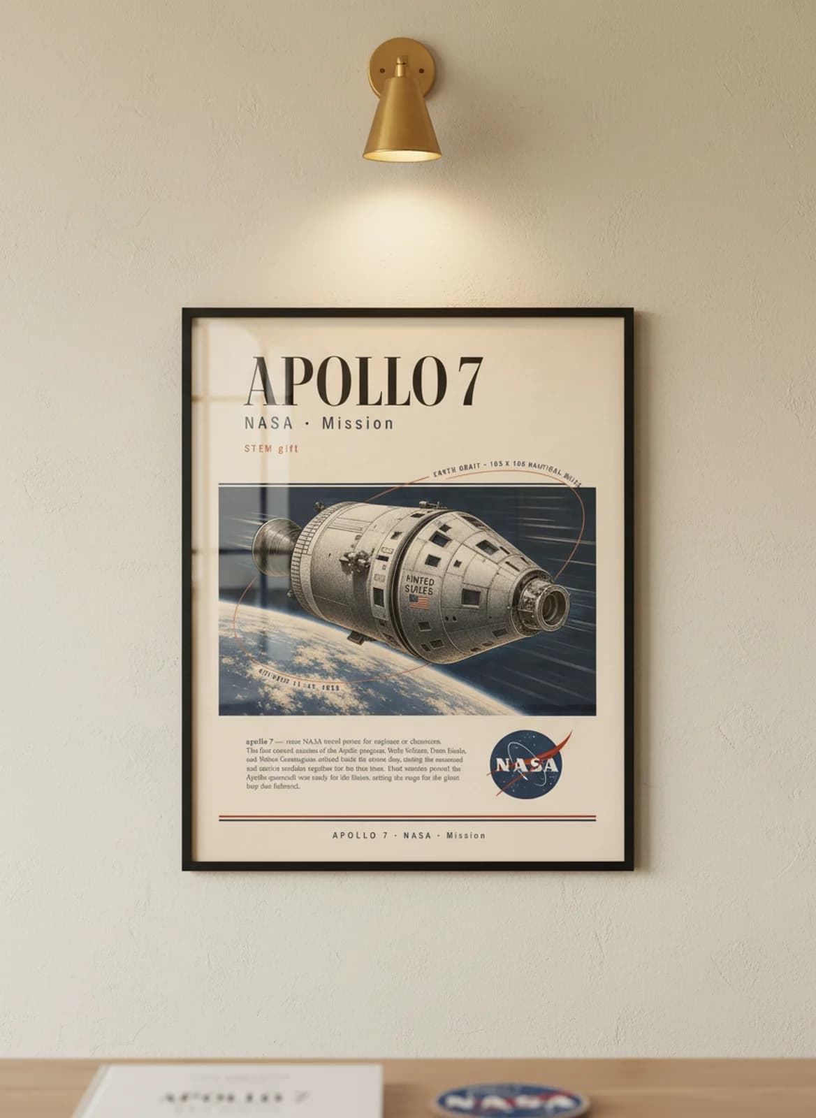 APOLLO 7 — NASA Missions poster in black A2 frame on warm-cream-paper wall matching print paper — NASA Missions study mockup