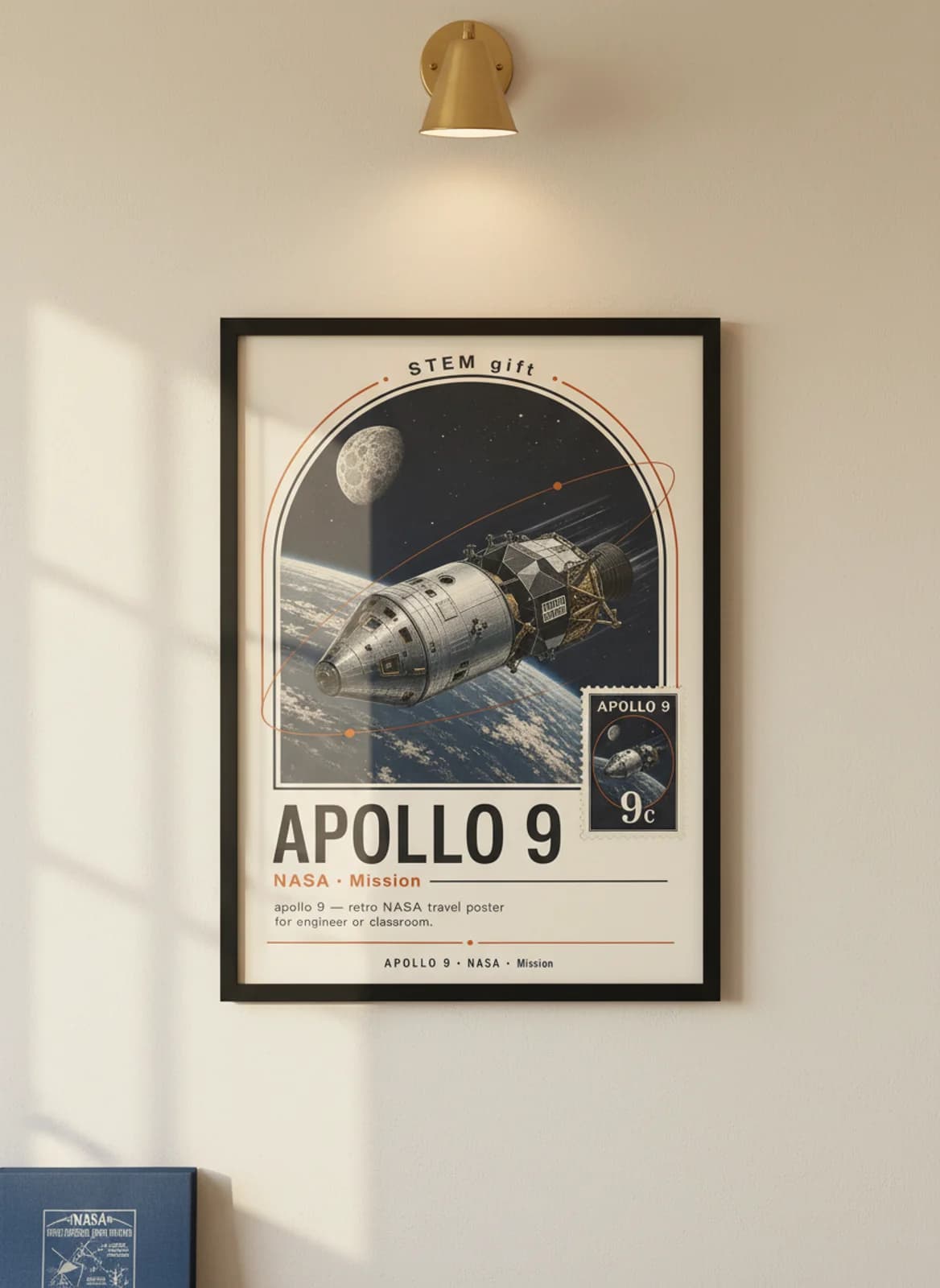 APOLLO 9 — NASA Missions poster in black A2 frame on warm-cream-paper wall matching print paper — NASA Missions study mockup