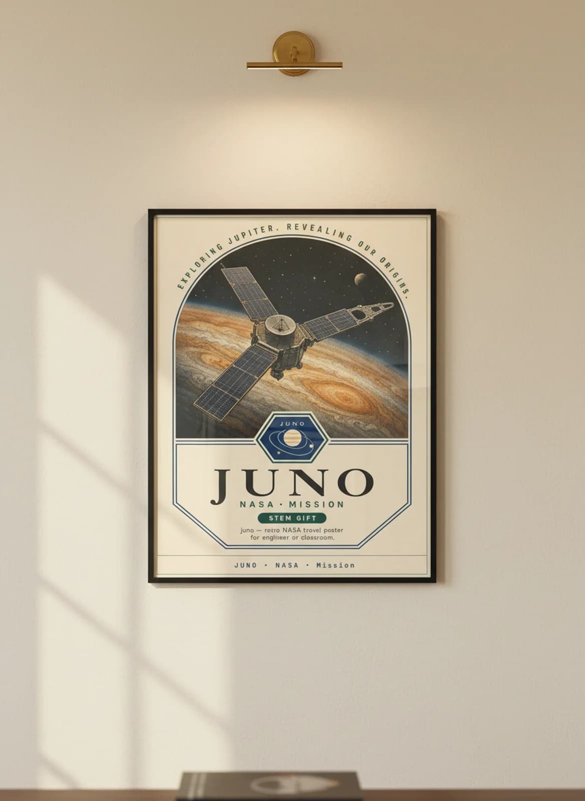 JUNO — NASA Missions poster in black A2 frame on warm-cream-paper wall matching print paper — NASA Missions study mockup