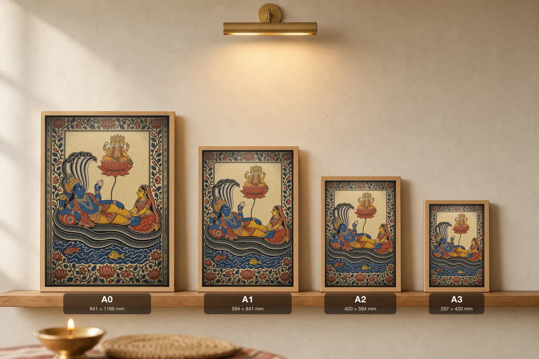 Ananta Shayana Pattachitra Print — Vishnu reclining on the cosmic serpent with Lakshmi and lotus-born Brahma · collector edition A2 · classical Odisha cloth-painting grammar — print size guide showing the artwork at A0, A1, A2 and A3 in natural-oak frames at true relative scale
