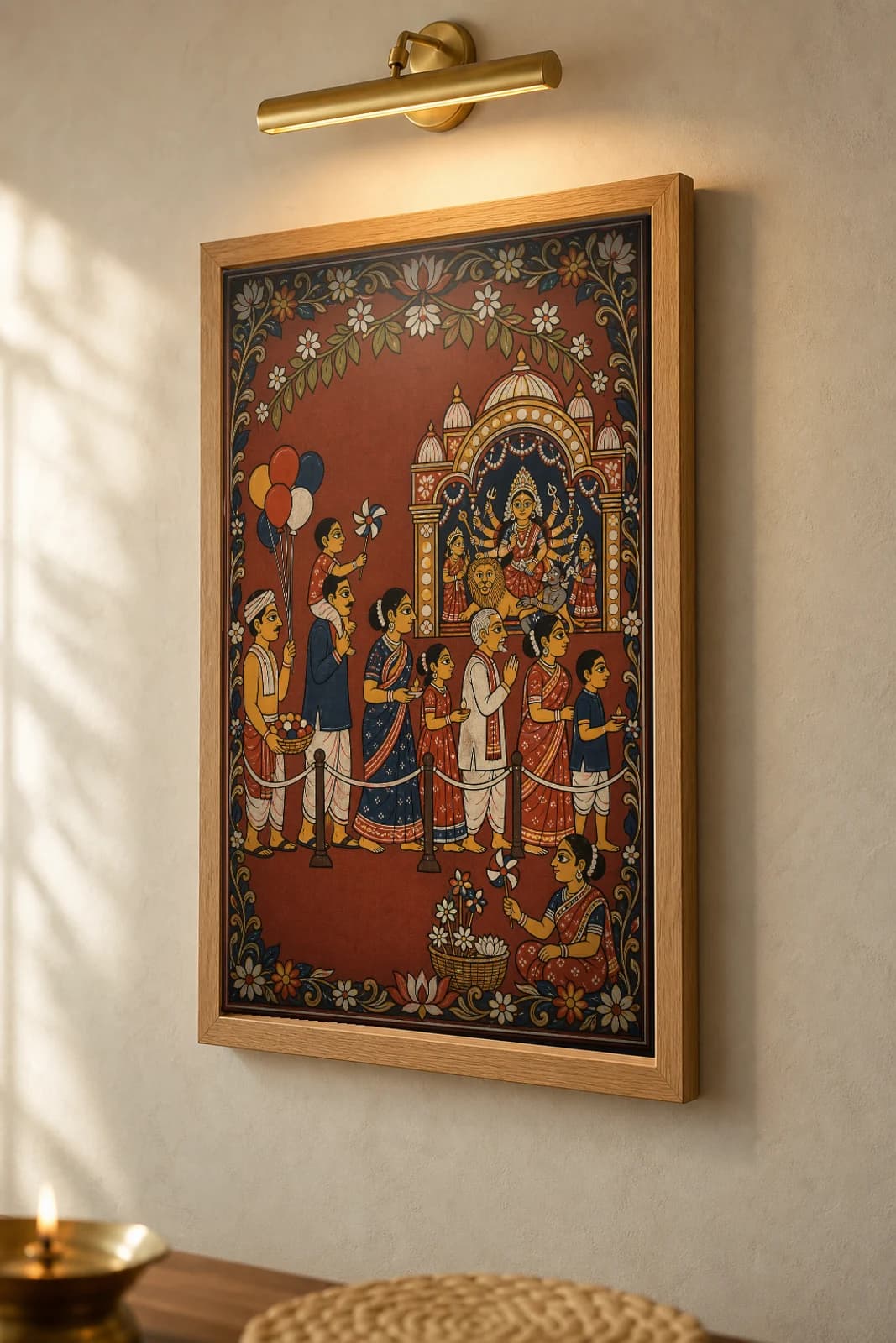 Durga Pandal Queue Pattachitra Print — devotees lined up for darshan at a Durga Puja pandal in patta line · collector edition A2 · contemporary fusion — the framed print shown at a three-quarter angle on a styled gallery wall in a natural-oak frame