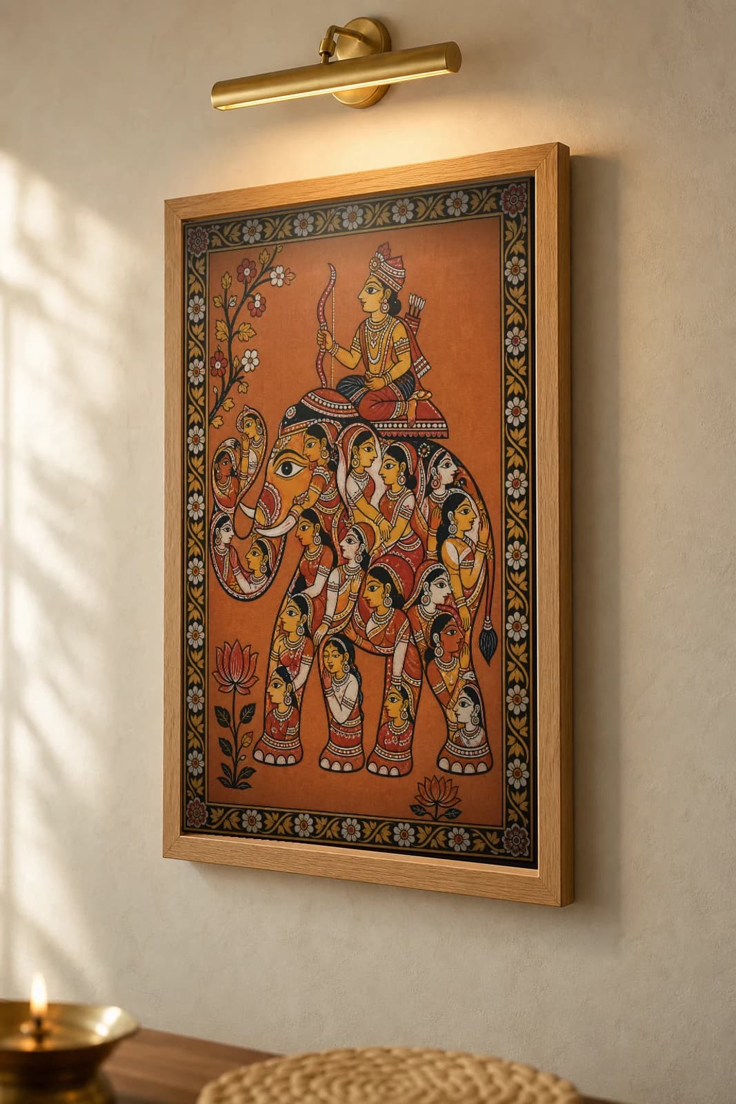 Kandarpa Hathi Pattachitra Print — the composite elephant of intertwined maidens with a rider · collector edition A2 · classical Odisha cloth-painting grammar — the framed print shown at a three-quarter angle on a styled gallery wall in a natural-oak frame