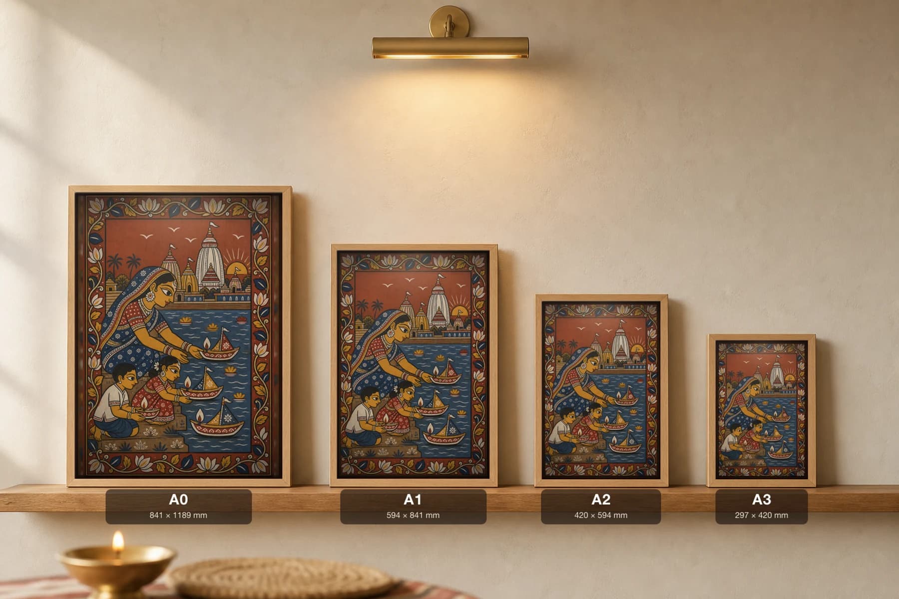 Boita Bandana Pattachitra Print — a family floating lamp-boats at dawn on Kartik Purnima · collector edition A2 · contemporary fusion — print size guide showing the artwork at A0, A1, A2 and A3 in natural-oak frames at true relative scale