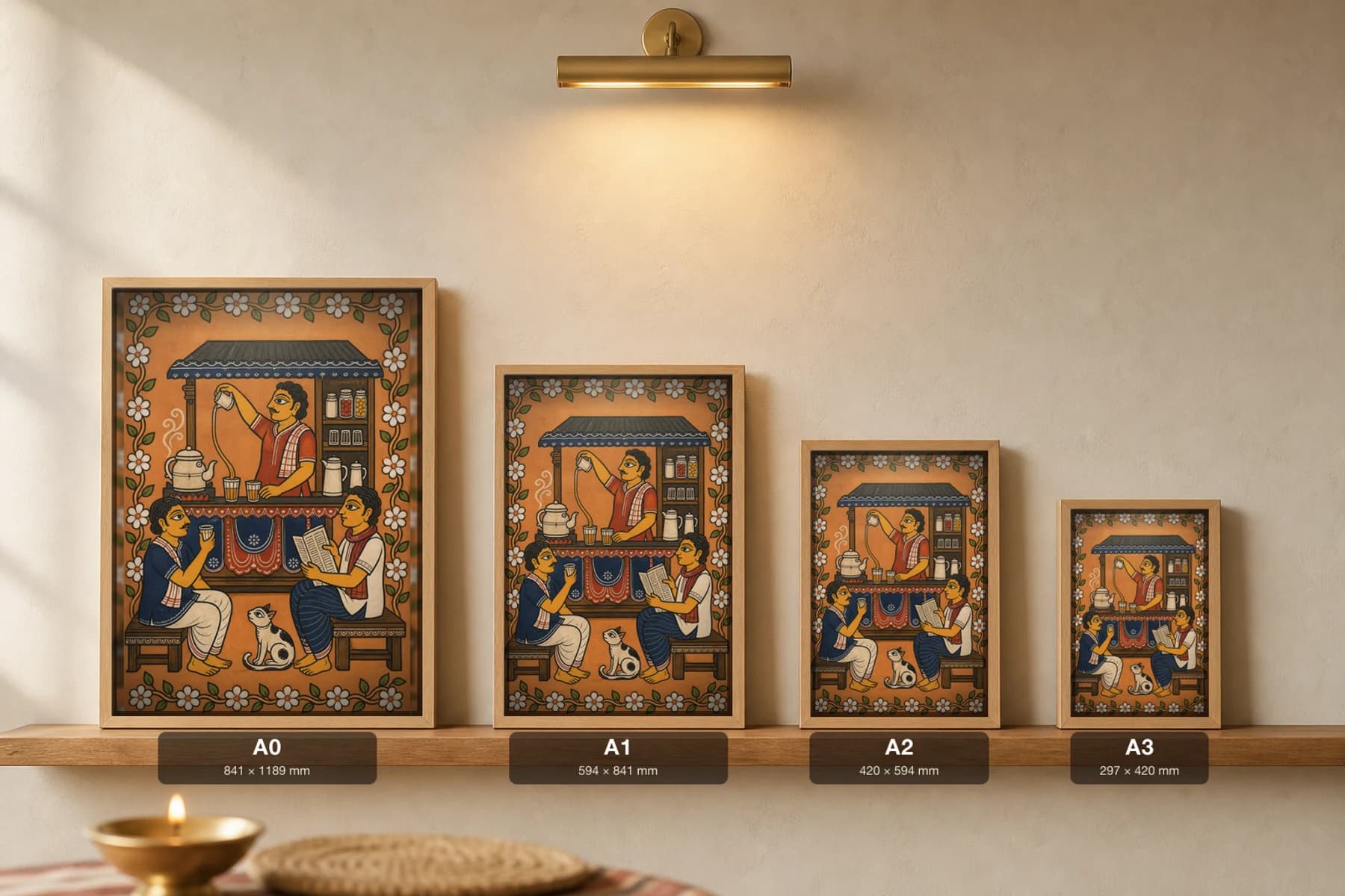 Cha Dukan Pattachitra Print — an evening roadside tea stall in Odisha cloth-painting grammar · collector A2 · contemporary fusion — print size guide showing the artwork at A0, A1, A2 and A3 in natural-oak frames at true relative scale