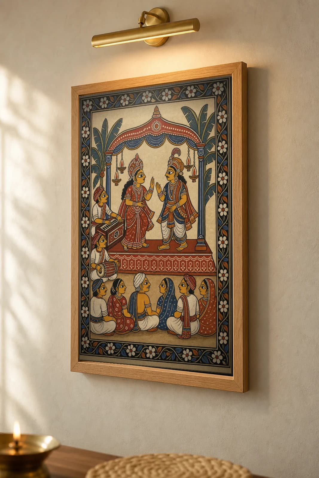 Jatra Night Pattachitra Print — an open-air village folk-theatre stage in Odisha cloth-painting grammar · collector A2 · contemporary fusion — the framed print shown at a three-quarter angle on a styled gallery wall in a natural-oak frame