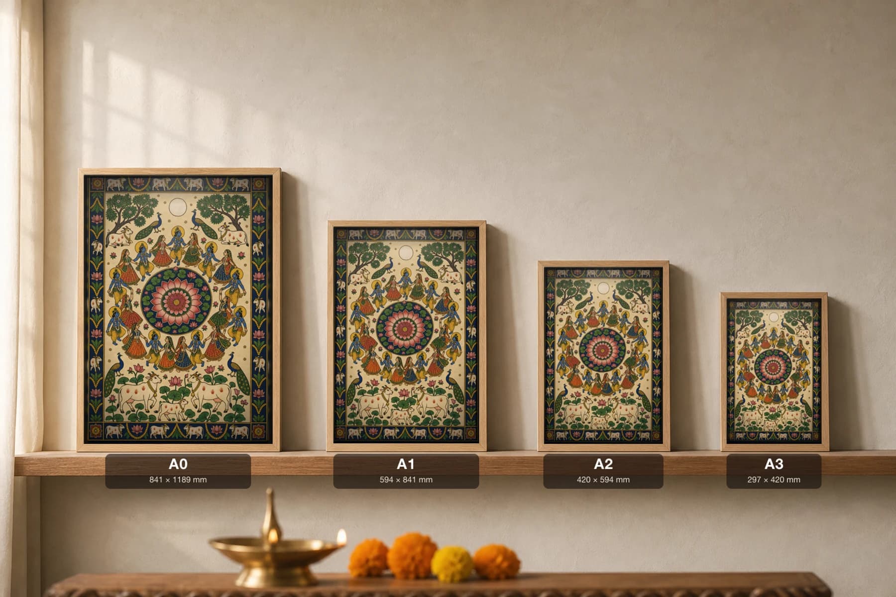 Raas Mandala Pichwai-Style Print — gopis and Krishna dancing in concentric rings around a central lotus under a full moon, with cows and a lotus pond below, on warm cream cloth — print size guide showing the artwork at A0, A1, A2 and A3 in natural-oak frames at true relative scale