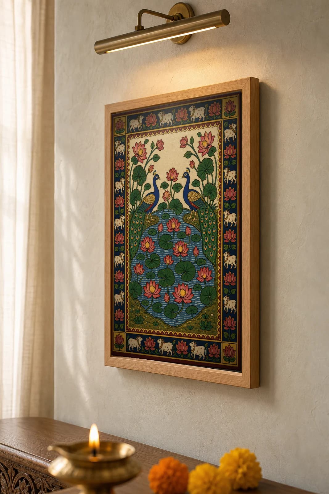Kamal-Mayur Pichwai-Style Print — Two Peacocks Above a Lotus Tank · collector A2 · Nathdwara, Rajasthan cloth-painting tradition — the framed print shown at a three-quarter angle on a styled gallery wall in a natural-oak frame
