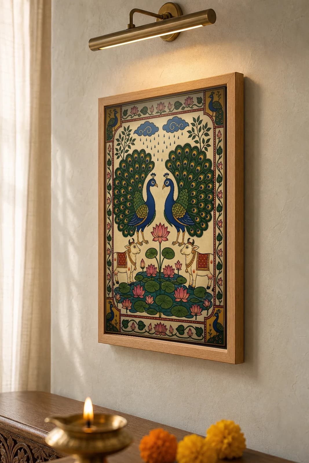 Mayur Jodi Pichwai-Style Print — Facing Peacock Pair Over a Lotus Tank · collector A2 · Nathdwara, Rajasthan cloth-painting tradition — the framed print shown at a three-quarter angle on a styled gallery wall in a natural-oak frame