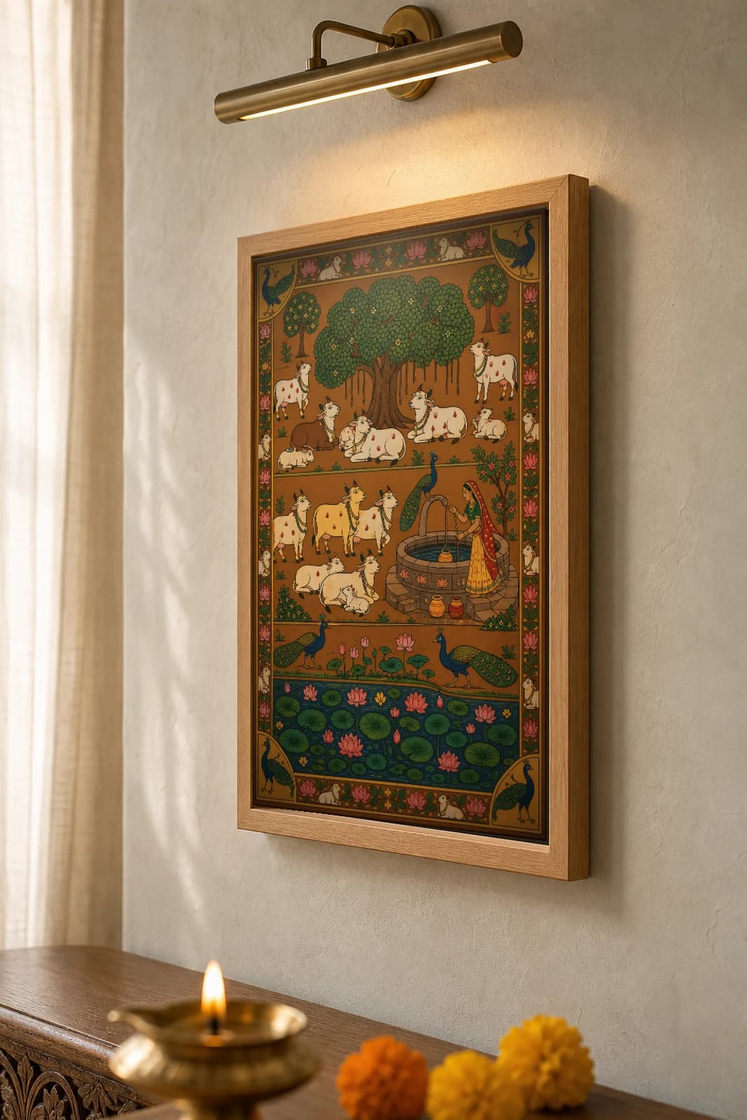 Kuan Pe Gau Pichwai-Style Print — Cows Resting at the Village Well at Noon · collector A2 · contemporary × Nathdwara Pichwai fusion — the framed print shown at a three-quarter angle on a styled gallery wall in a natural-oak frame