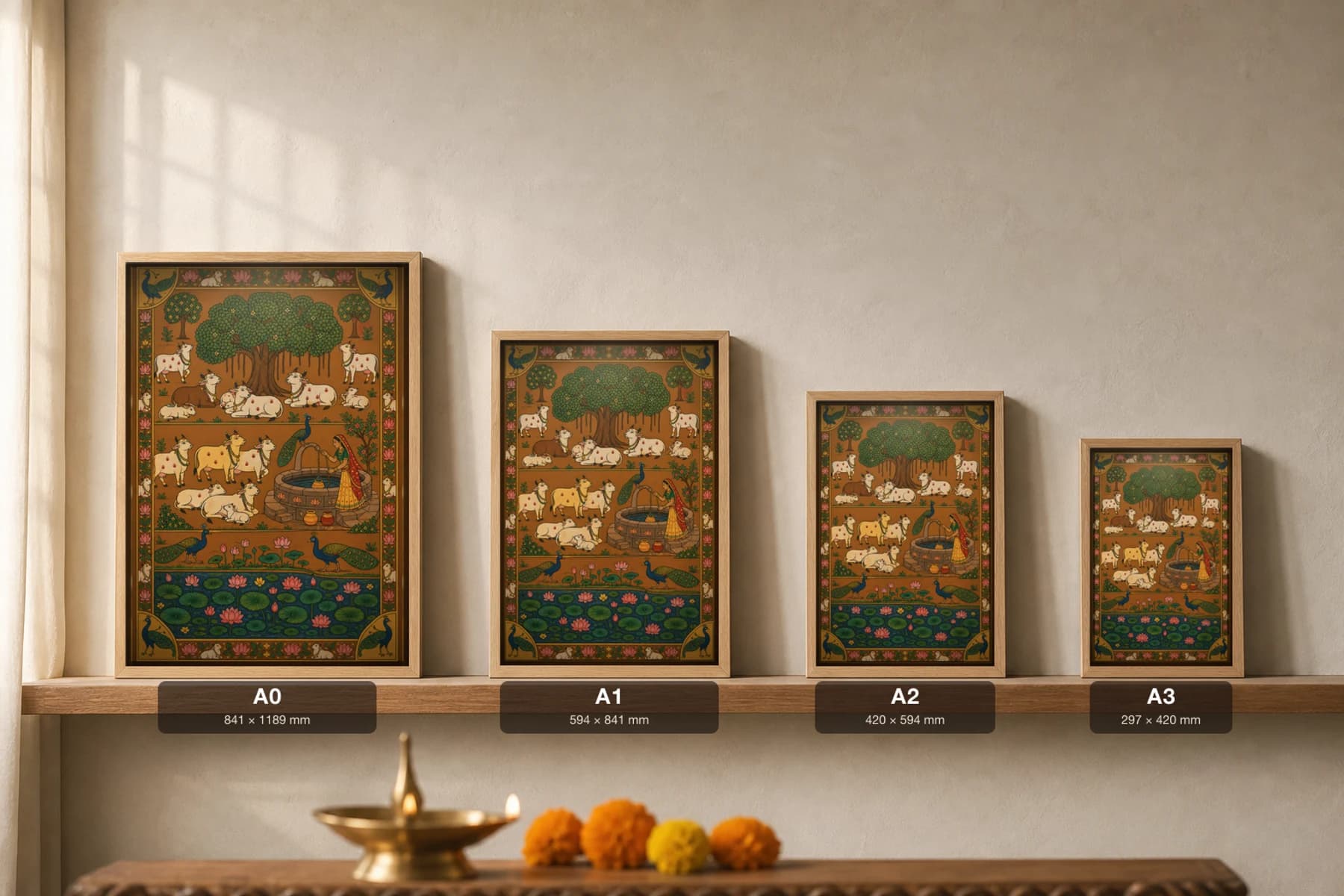 Kuan Pe Gau Pichwai-Style Print — Cows Resting at the Village Well at Noon · collector A2 · contemporary × Nathdwara Pichwai fusion — print size guide showing the artwork at A0, A1, A2 and A3 in natural-oak frames at true relative scale