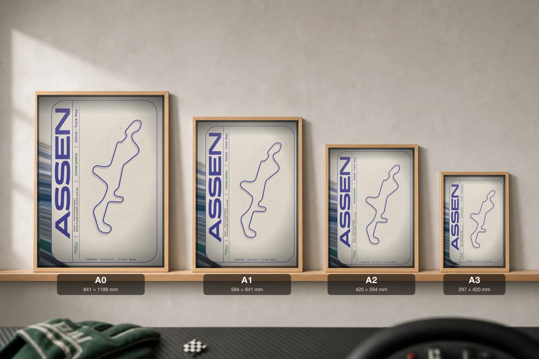 TT Circuit Assen Poster — Netherlands circuit map wall art · MotoGP Dutch TT track layout · framed A2 — print size guide showing the artwork at A0, A1, A2 and A3 in natural-oak frames at true relative scale