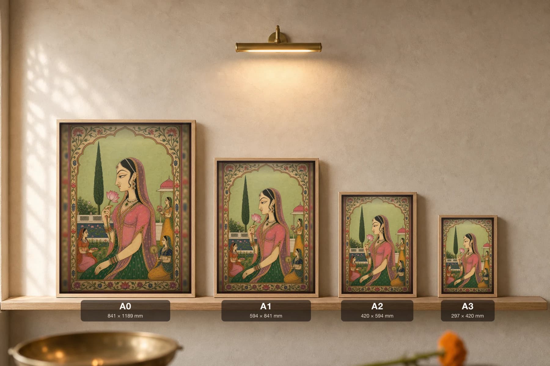 Bani Thani Rajput Miniature Print — the idealized Kishangarh profile in an arched garden, lotus in hand · collector edition A2 — print size guide showing the artwork at A0, A1, A2 and A3 in natural-oak frames at true relative scale
