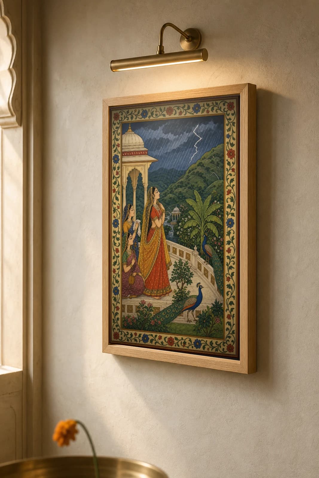 Sawan Baramasa Rajput Miniature Print — Kangra monsoon month, a lady watching the rains with dancing peacocks · collector edition A2 — the framed print shown at a three-quarter angle on a styled gallery wall in a natural-oak frame