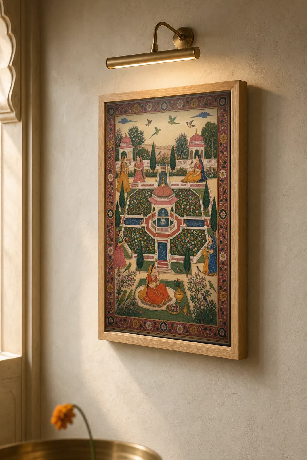 Char Bagh Rajput Miniature Print — Amber fourfold paradise garden seen from above, water channels and a central fountain · collector edition A2 — the framed print shown at a three-quarter angle on a styled gallery wall in a natural-oak frame