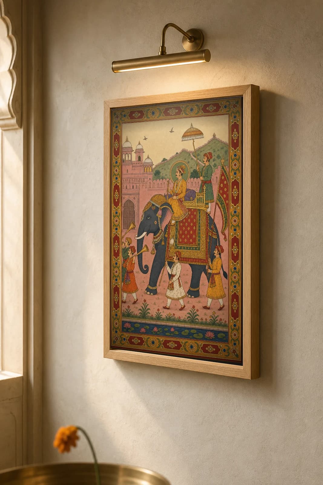 Gaj Sawari Rajput Miniature Print — Amber royal elephant procession, a prince on a caparisoned tusker beneath a parasol · collector edition A2 — the framed print shown at a three-quarter angle on a styled gallery wall in a natural-oak frame