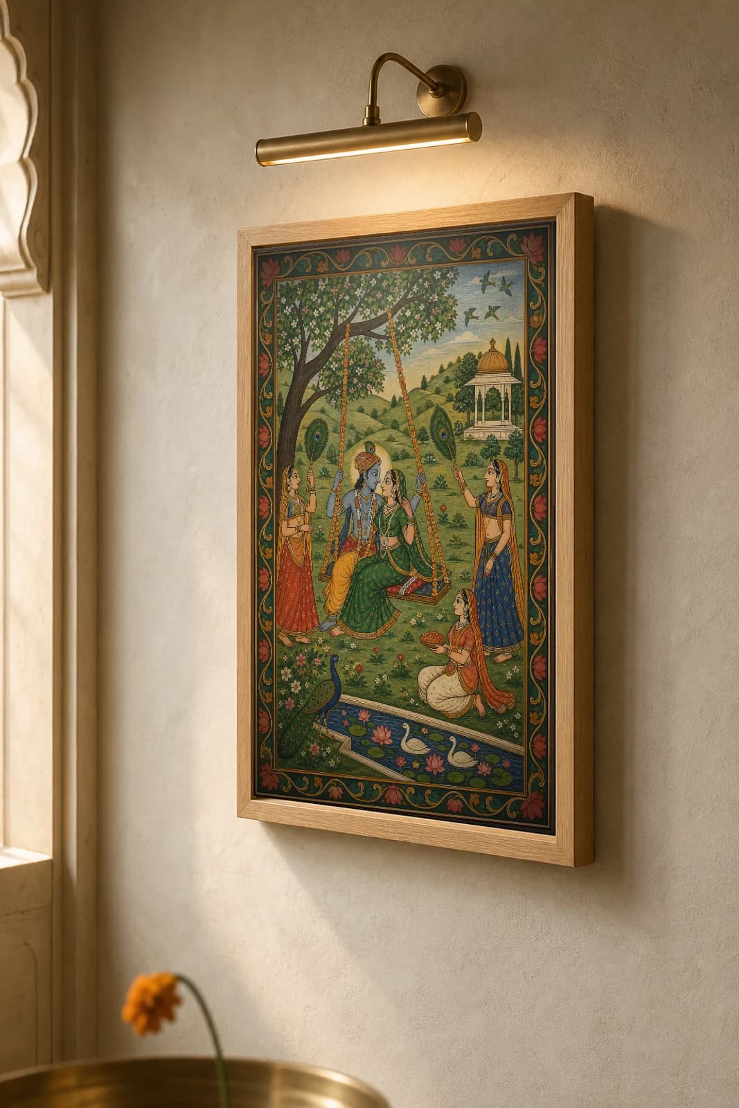 Hindola Raga Rajput Miniature Print — Kangra monsoon swing-raga of the Teej season, lovers on a flower-hung jhula · collector edition A2 — the framed print shown at a three-quarter angle on a styled gallery wall in a natural-oak frame