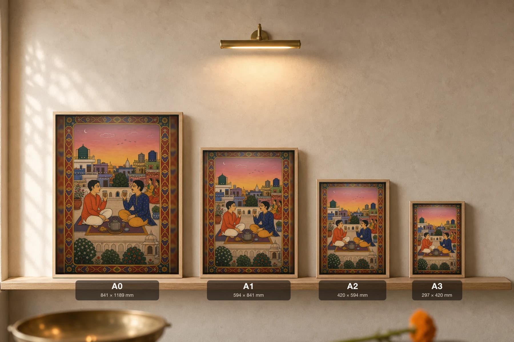 Rooftop Chai — Evening Terrace Tea Rajput Miniature Art Print · collector edition A2 · two friends sharing chai on a city rooftop at dusk, Mewar pavilion grammar — print size guide showing the artwork at A0, A1, A2 and A3 in natural-oak frames at true relative scale