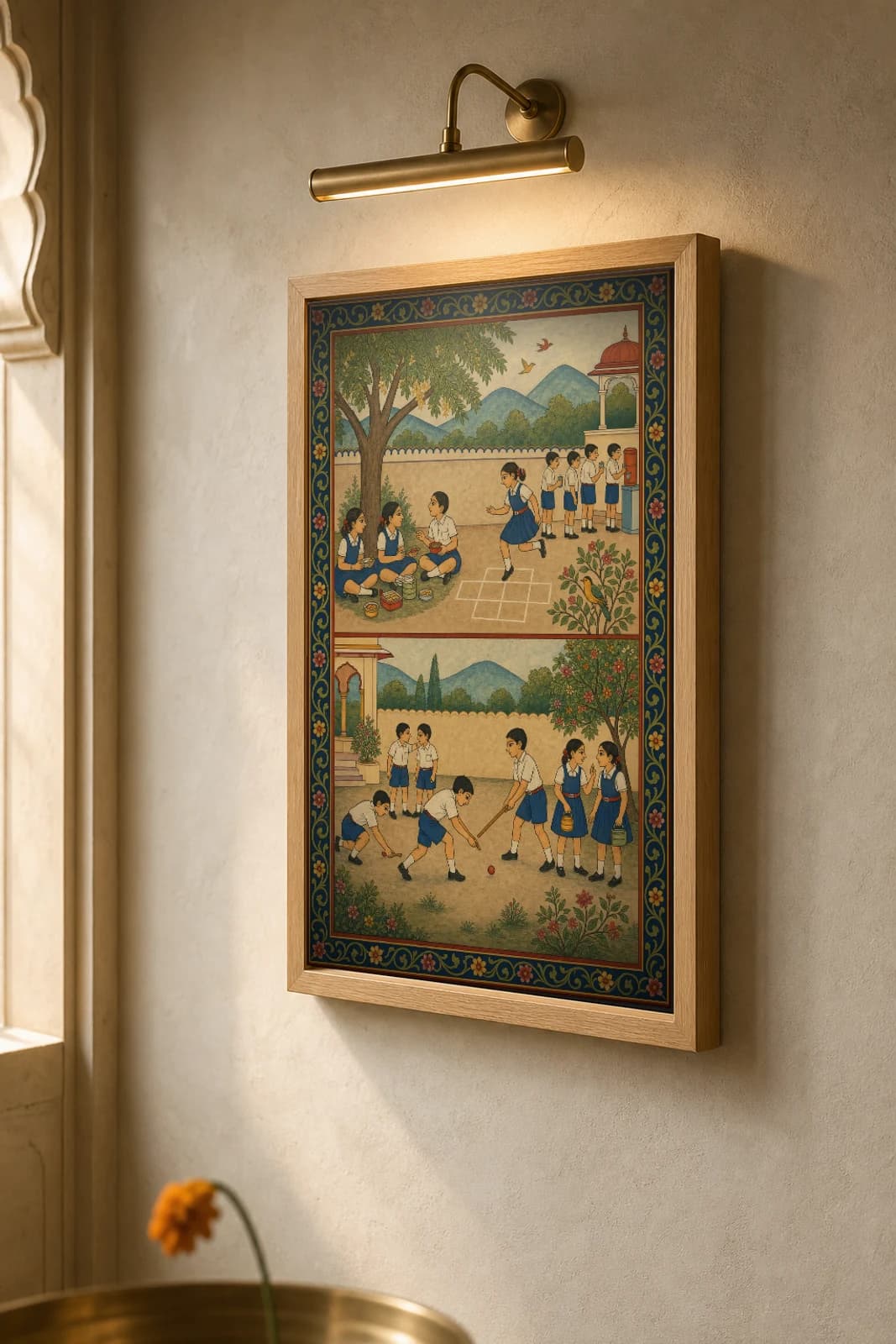 Madhyantar — School Tiffin Recess Rajput Miniature Art Print · collector edition A2 · children in uniform sharing tiffin and playing in a school yard, Kangra grammar — the framed print shown at a three-quarter angle on a styled gallery wall in a natural-oak frame