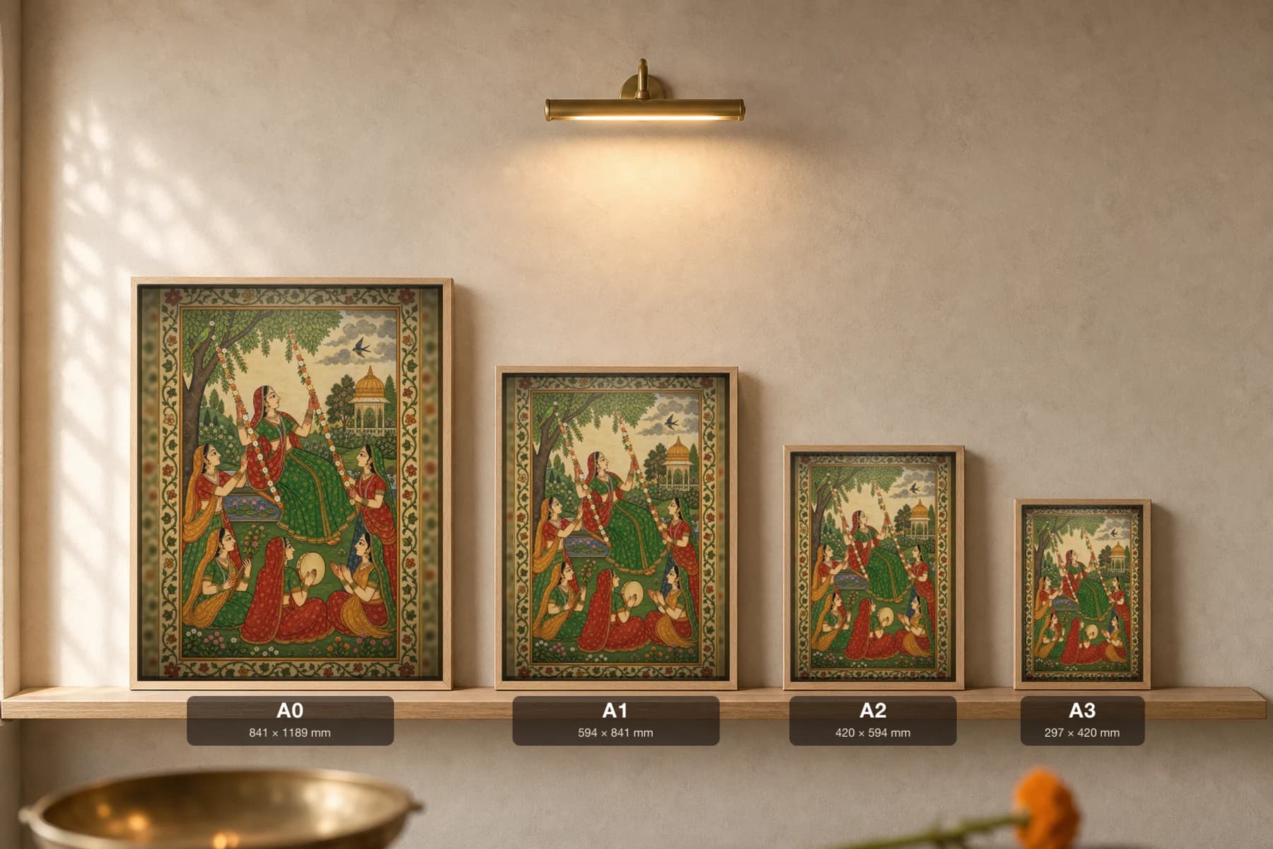 Teej Jhula — Monsoon Swing Festival Rajput Miniature Art Print · collector edition A2 · a woman on a flower-decked swing among companions in a monsoon garden, Kangra grammar — print size guide showing the artwork at A0, A1, A2 and A3 in natural-oak frames at true relative scale
