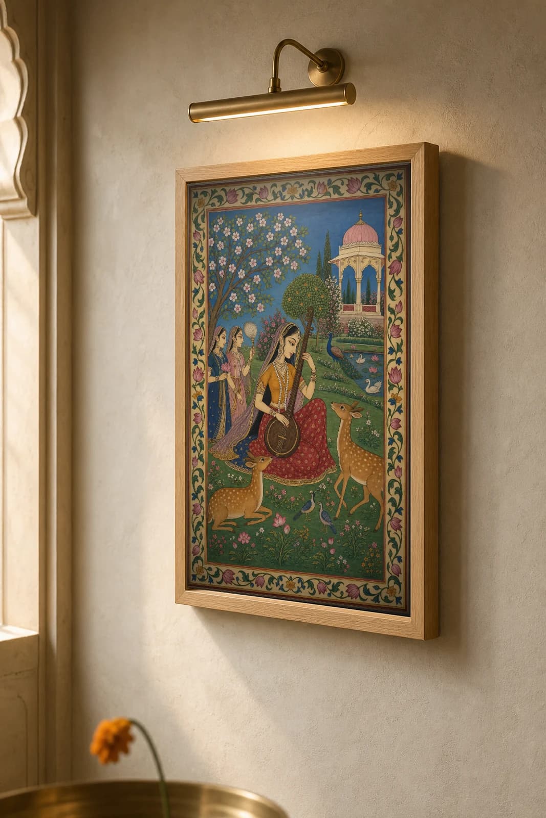 Todi Ragini Rajput Miniature Print — Kishangarh Ragamala, the veena-playing nayika charming the deer in a flowering garden · collector edition A2 — the framed print shown at a three-quarter angle on a styled gallery wall in a natural-oak frame