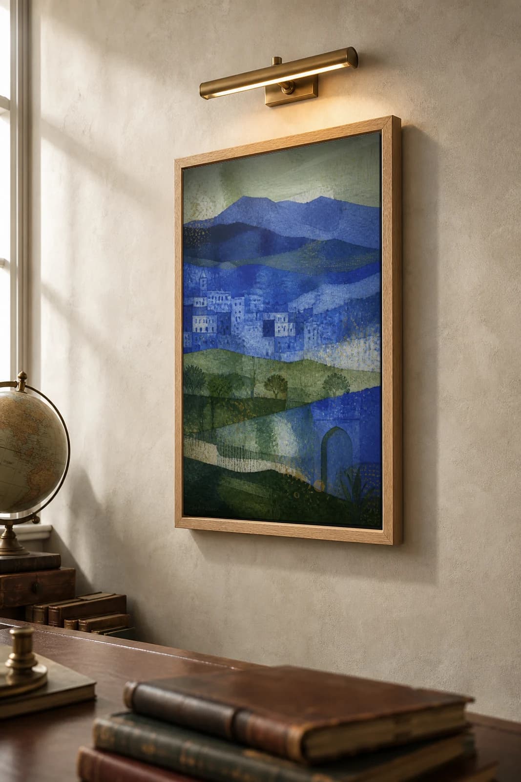 Chefchaouen Poster — Morocco travel wall art · city print · framed A2 — the framed print shown at a three-quarter angle on a styled gallery wall in a natural-oak frame