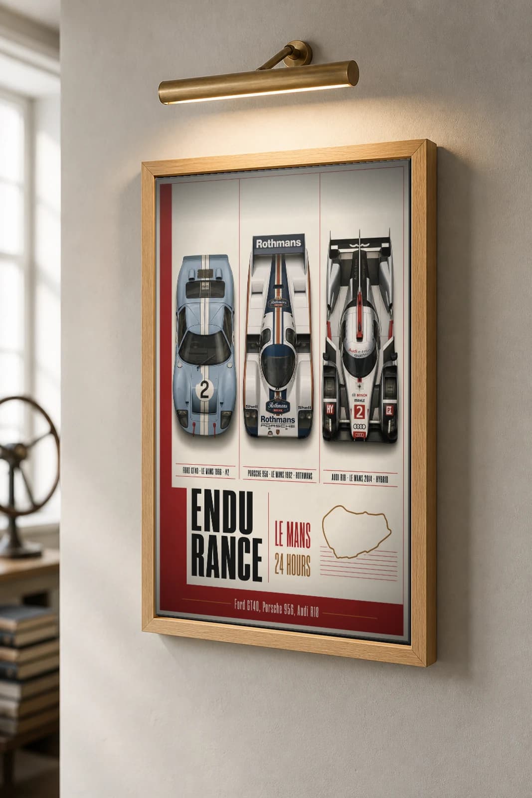 Factory / works endurance entries GT40 · 956 · R18 Poster — Le Mans-winning sportscars · Group C prototype · LMP1 hybrid WEC racing wall art · #2 · framed A2 — the framed print shown at a three-quarter angle on a styled gallery wall in a natural-oak frame