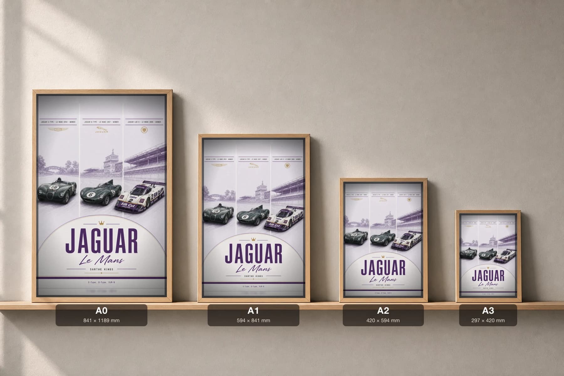 Jaguar factory / works entries C-Type / D-Type / XJR-9 Poster — Le Mans-winning sportscars WEC racing wall art · #18 / 6 / 2 · framed A2 — print size guide showing the artwork at A0, A1, A2 and A3 in natural-oak frames at true relative scale