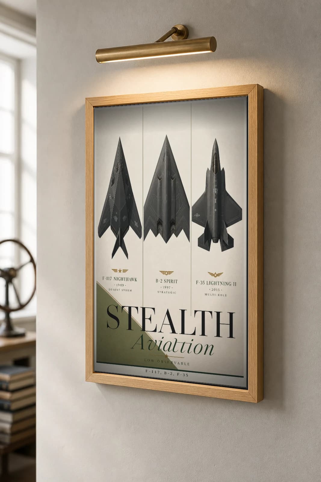 US Stealth Aviation Ensemble Poster — United States Air Force military aviation wall art · framed A2 · 1989–2015 — the framed print shown at a three-quarter angle on a styled gallery wall in a natural-oak frame