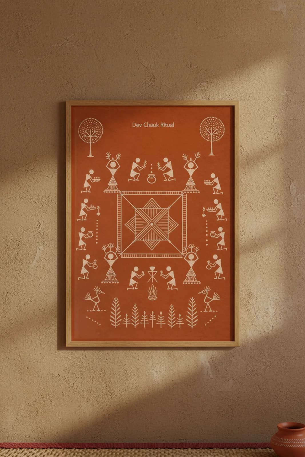 Dev Chauk Ritual Warli print in natural oak A2 frame on warm-earth-neutral mud-plaster wall — rustic Indian folk art mockup