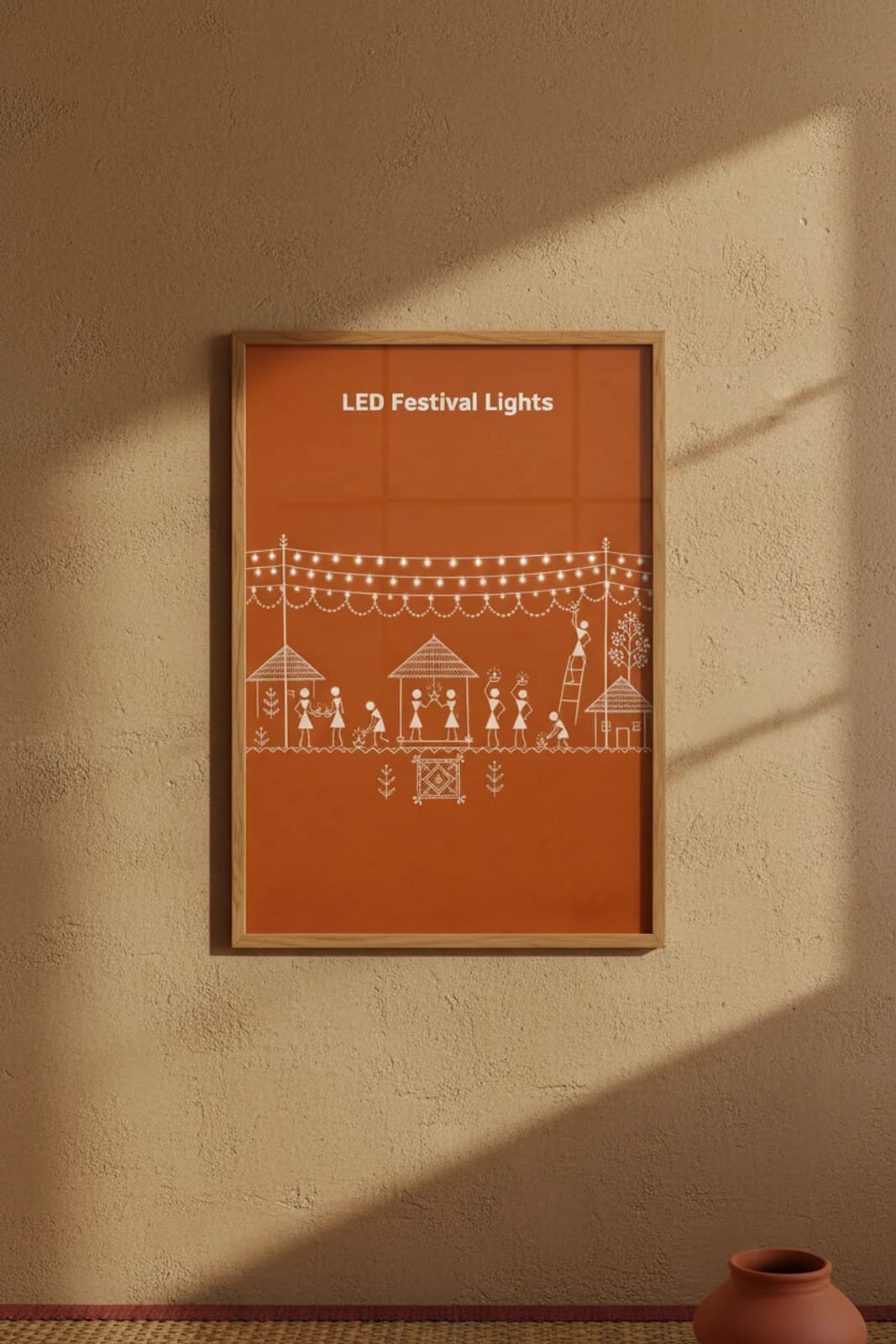 LED Festival Lights Warli print in natural oak A2 frame on warm-earth-neutral mud-plaster wall — rustic Indian folk art mockup