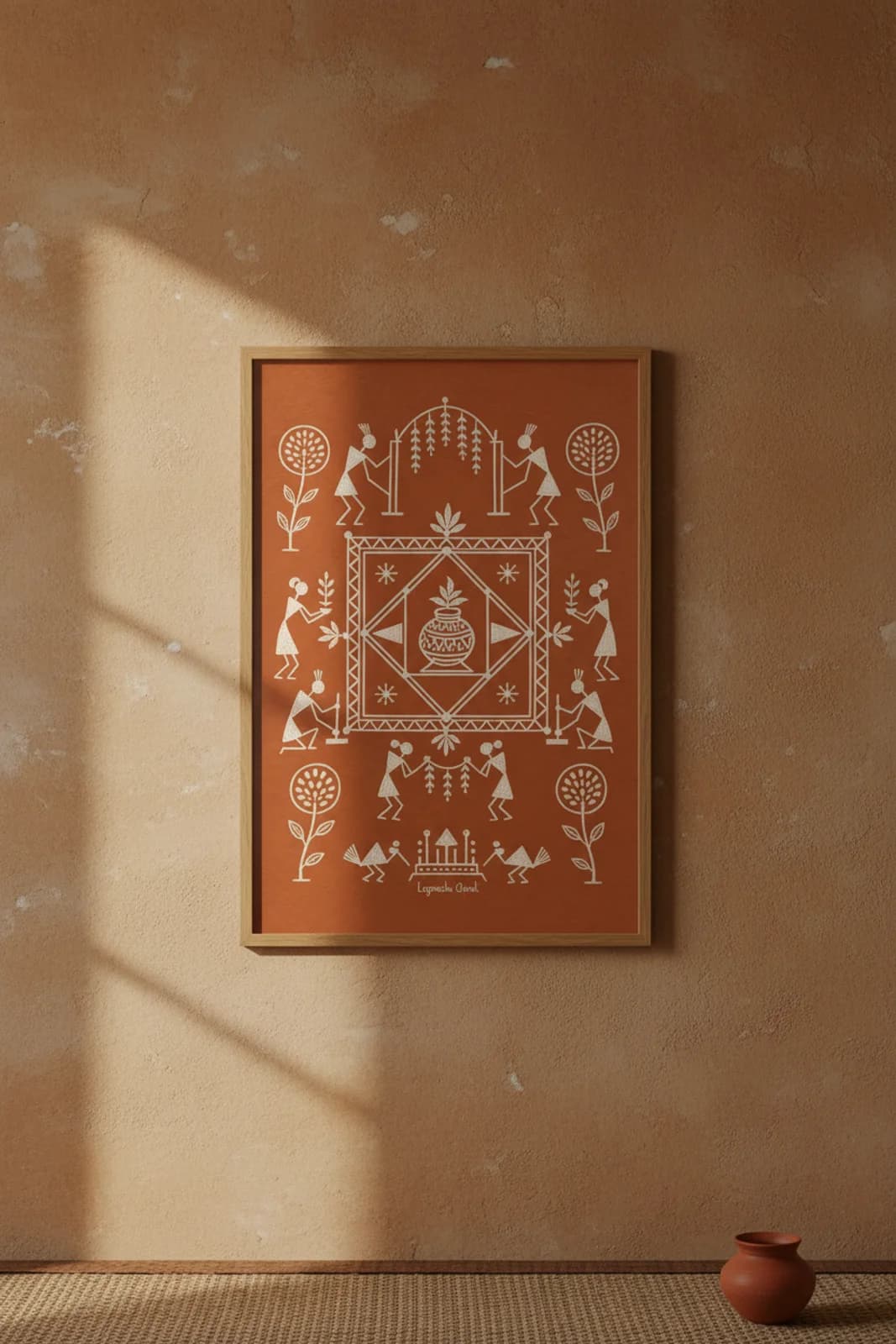 Lagnacha Chauk Warli print in natural oak A2 frame on warm-earth-neutral mud-plaster wall — rustic Indian folk art mockup