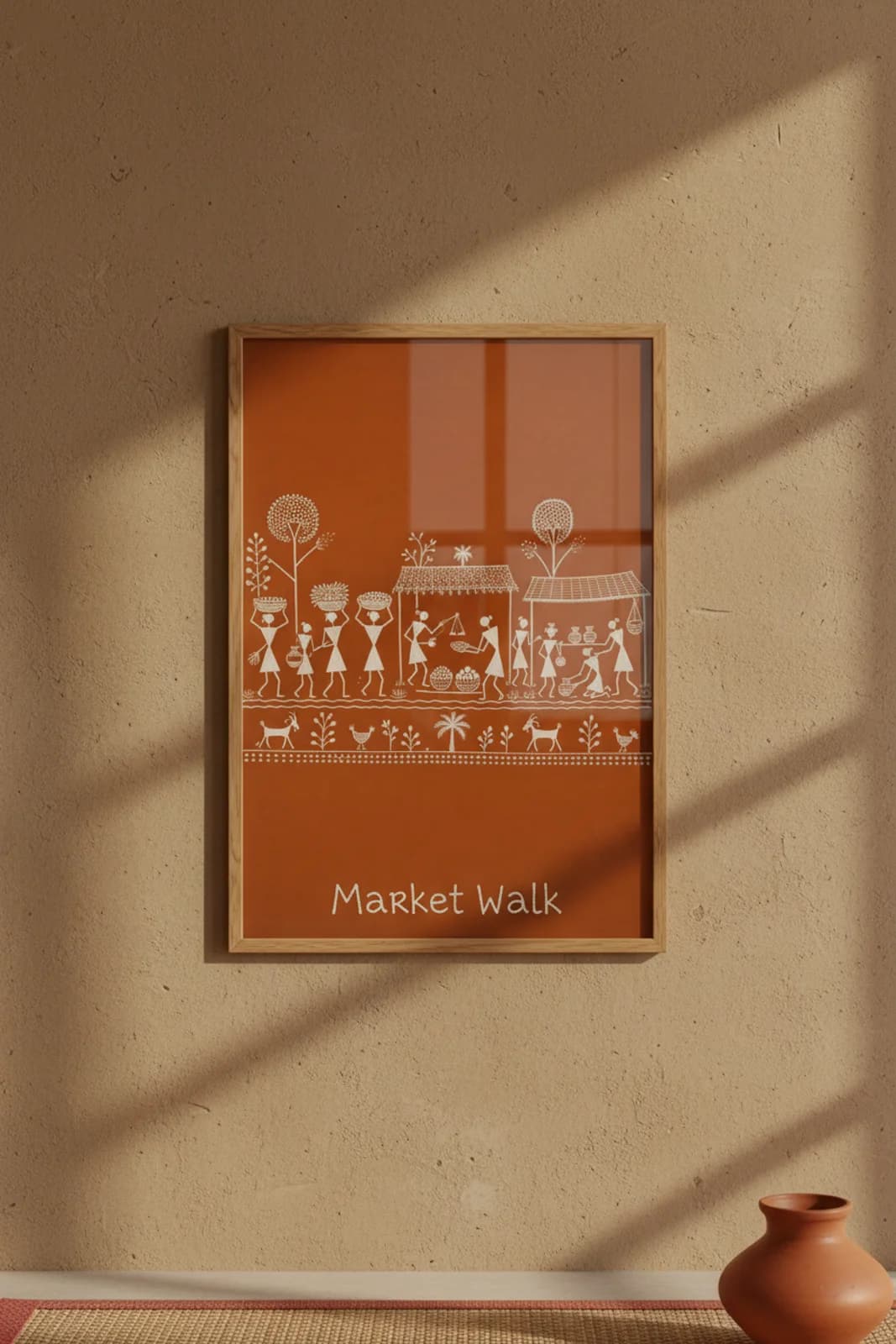 Market Walk Warli print in natural oak A2 frame on warm-earth-neutral mud-plaster wall — rustic Indian folk art mockup