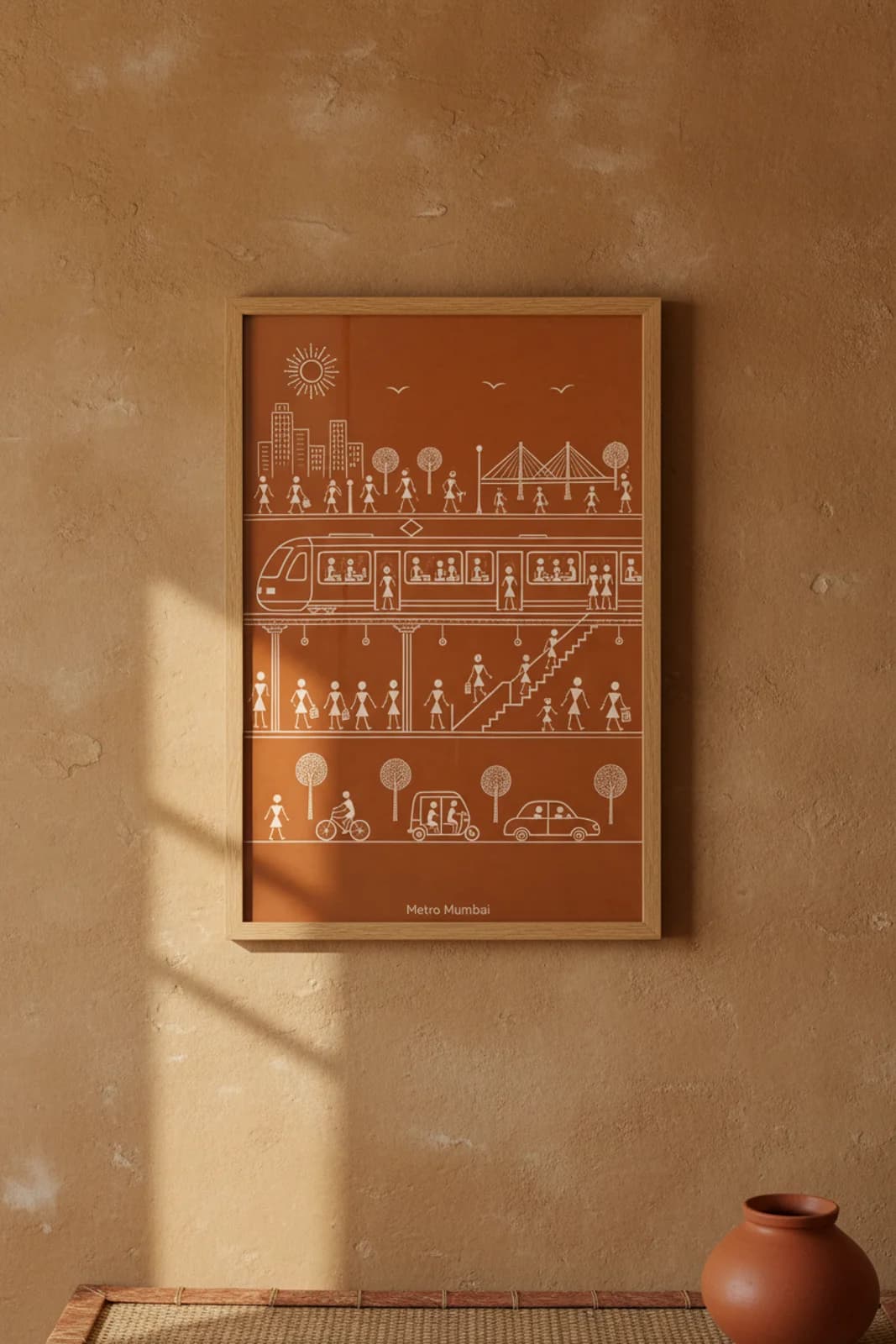 Metro Mumbai Warli print in natural oak A2 frame on warm-earth-neutral mud-plaster wall — rustic Indian folk art mockup